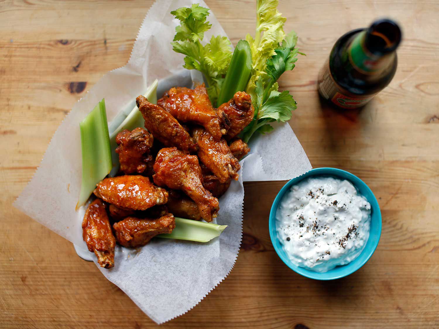 These are the Buffalo-resident's Buffalo wings: true to the original 1964 recipe, wings are fried in peanut oil and then tossed in a mixture of melted margarine and fiery hot sauce. Serve them up with blue cheese dressing and celery sticks to complete the classic dish. Get the recipe for <a href="https://www.saveur.com/buffalo-wing-trail-news">Buffalo Wings</a>