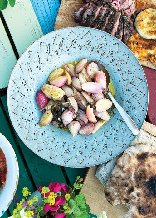 Milder than their cousin the onion, shallots are ideal for grilling. For a midsummer cookout in Sweden, home cook Asa Johanson tosses shallots in butter and olive oil, wraps them in foil with dill, and cooks the package slowly on the grill until the shallots soften and caramelize, taking on a deep, sweet flavor. Get the recipe for <a href="https://www.saveur.com/article/recipes/schalottenlok-i-folie-grilled-shallots-with-dill/">Schalottenlök i Folie (Grilled Shallots with Dill)</a>