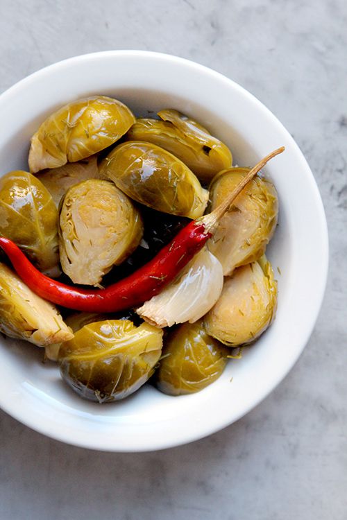For a twist on traditional sauerkraut, cookbook author Karen Solomon likes to soak Brussels sprouts in a briny mixture of peppercorn, dill, garlic, and chiles. Get the recipe for <a href="https://www.saveur.com/article/recipes/sprout-kraut/">Sprout Kraut</a>