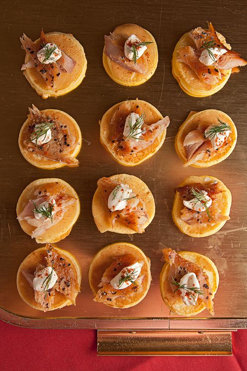 The smoked trout that tops these mini pancakes gets a slight kick from cayenne pepper. Get the recipe for <a href="http://www.saveur.com/article/recipe/Smoked-Trout-Blinis-with-Creme-Fraiche-and-Dill">Smoked Trout Blinis with Creme Fraiche and Dill</a>