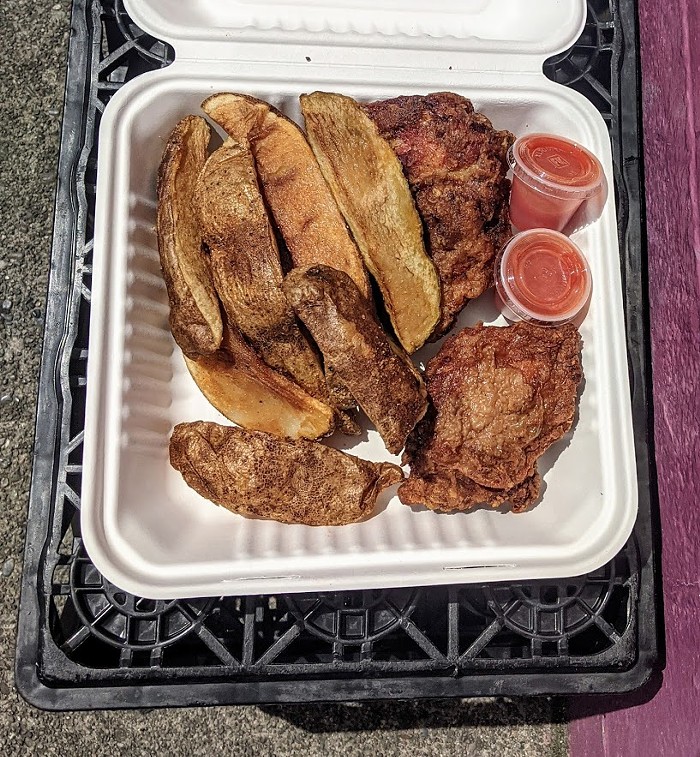 Fried chicken, extra-long biggie jojos, and hot sauce at Quick Pack Food Mart. Fried chicken, extra-long biggie jojos, and hot sauce at Quick Pack Food Mart.