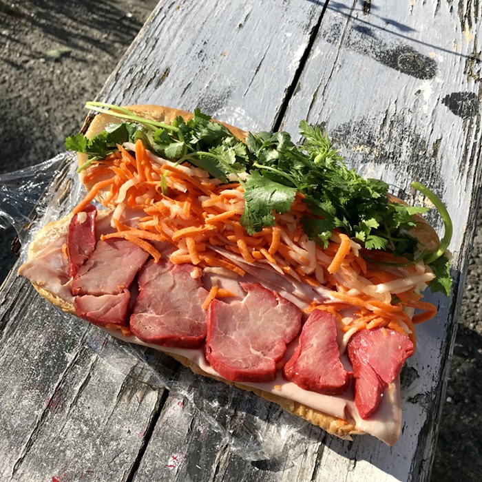 On a broke-ass bench on the street, where one eats a supermarket sandwich. On a broke-ass bench on the street, where one eats a supermarket sandwich.