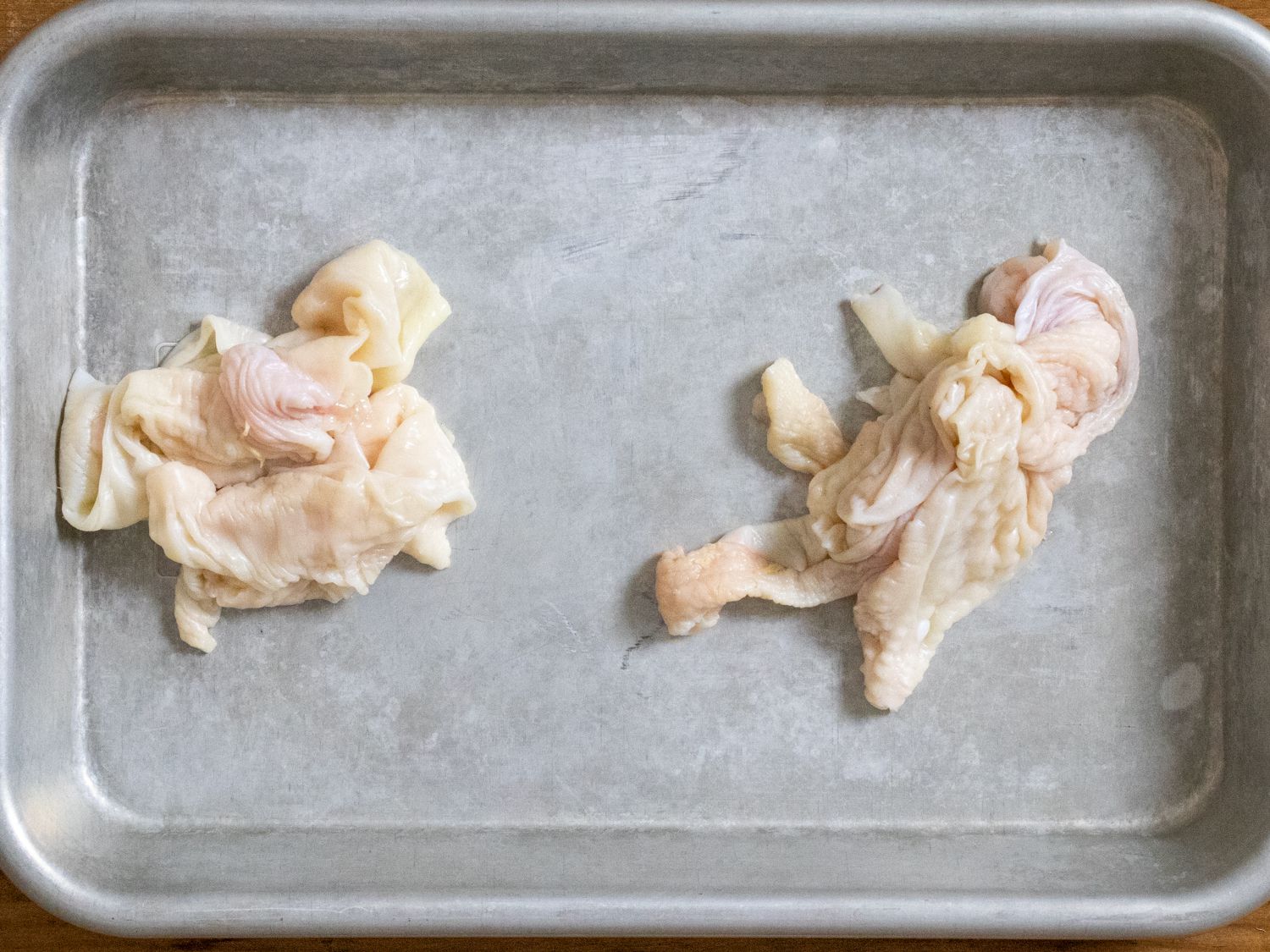 Chicken skin on a rimmed baking sheet