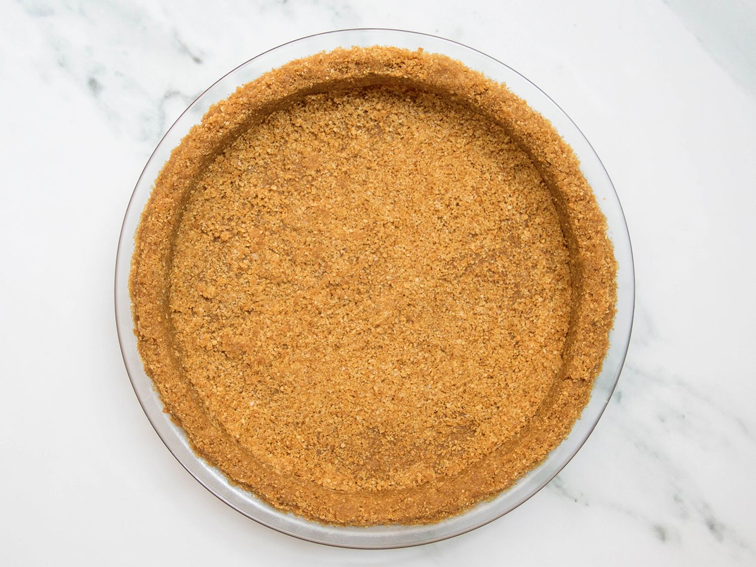 Baked vegan graham cracker crust in pie plate