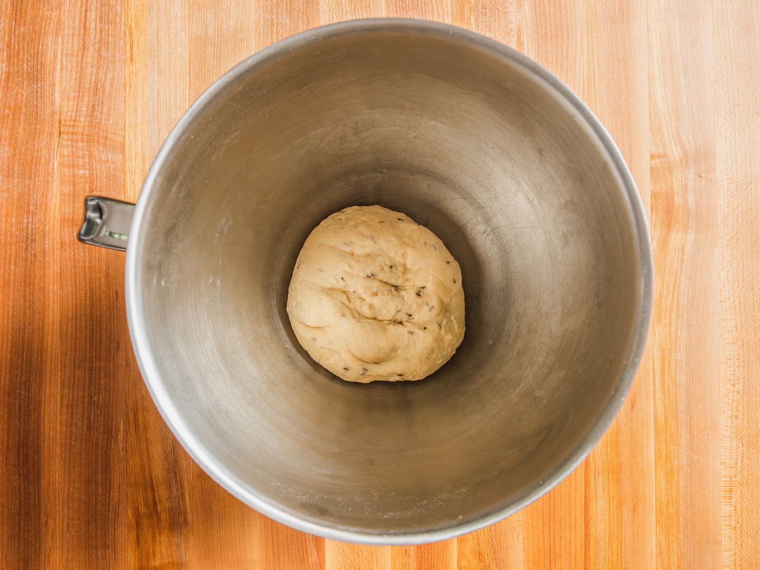 Ball of samosa pastry dough in bottom of stand mixer bowl