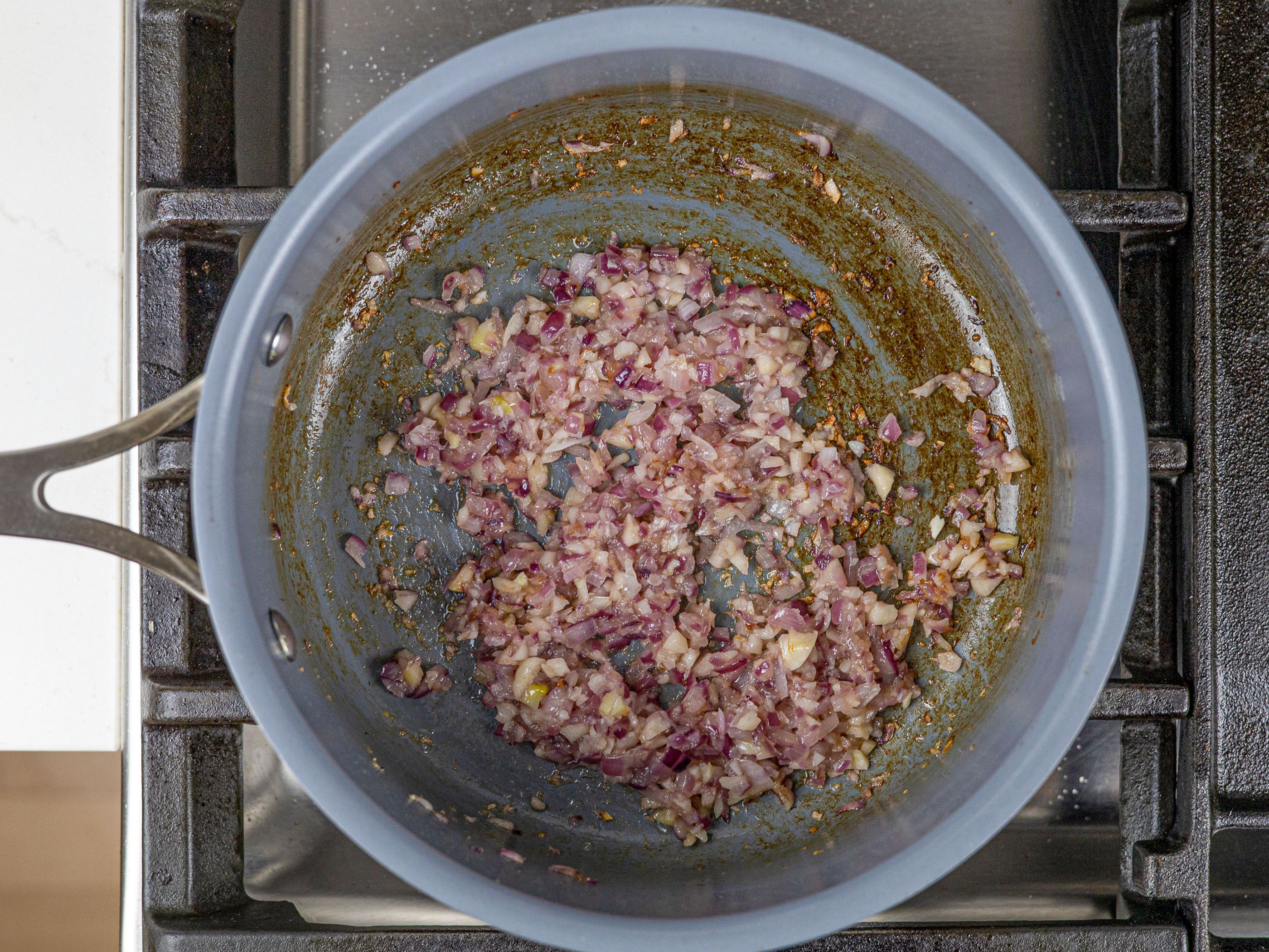 Aromatics being sauteed in a saucepan for pork blood sauce for dinuguan