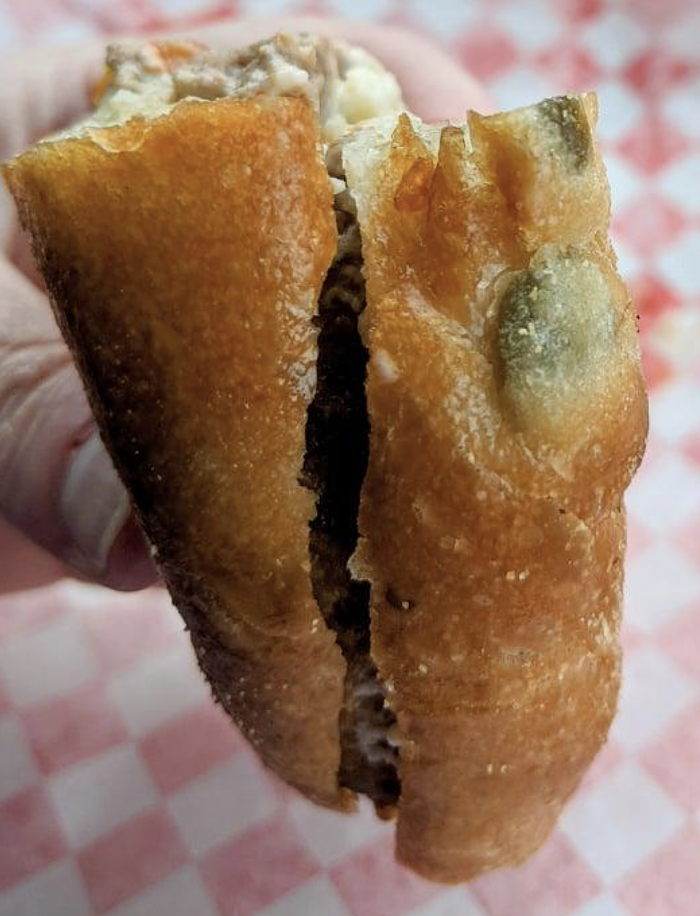 It’s a green olive. Don’t make a mess. Just eat it.