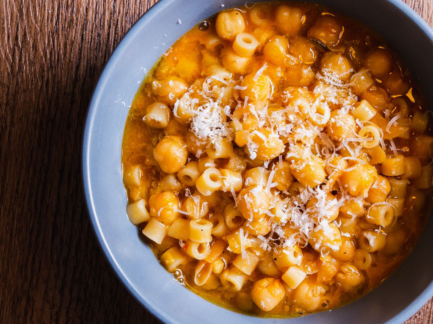 pasta e ceci close up in a blue bowl