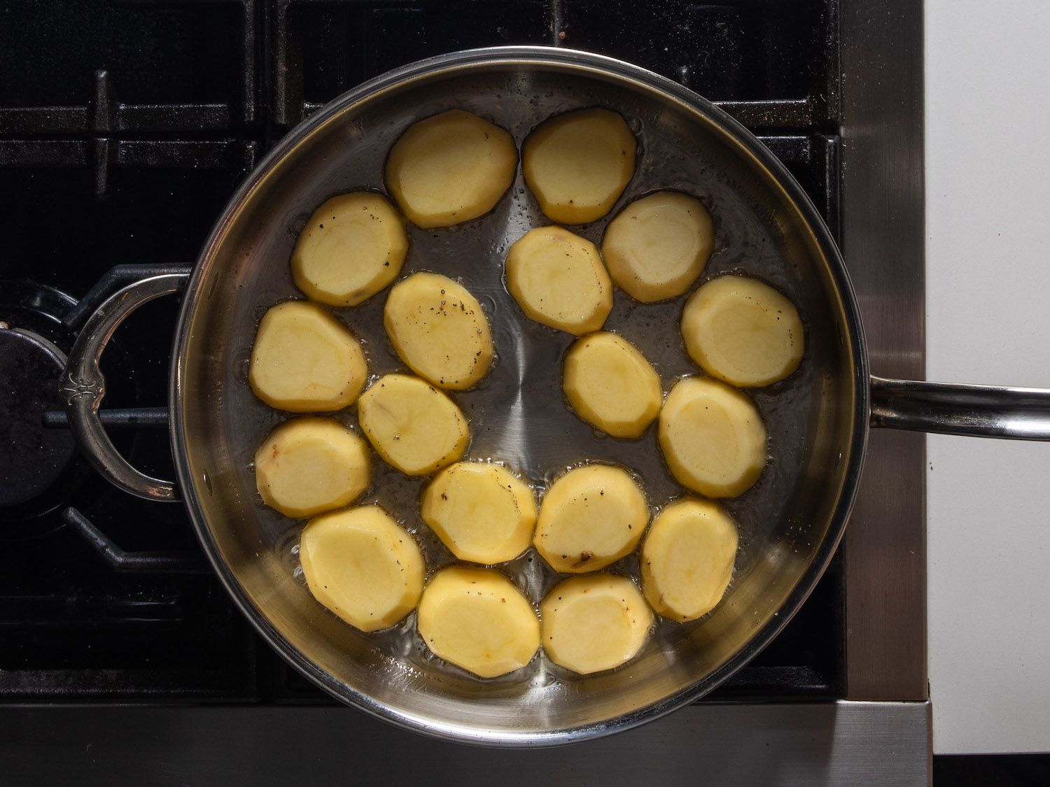Searing potatoes in a large sauté pan