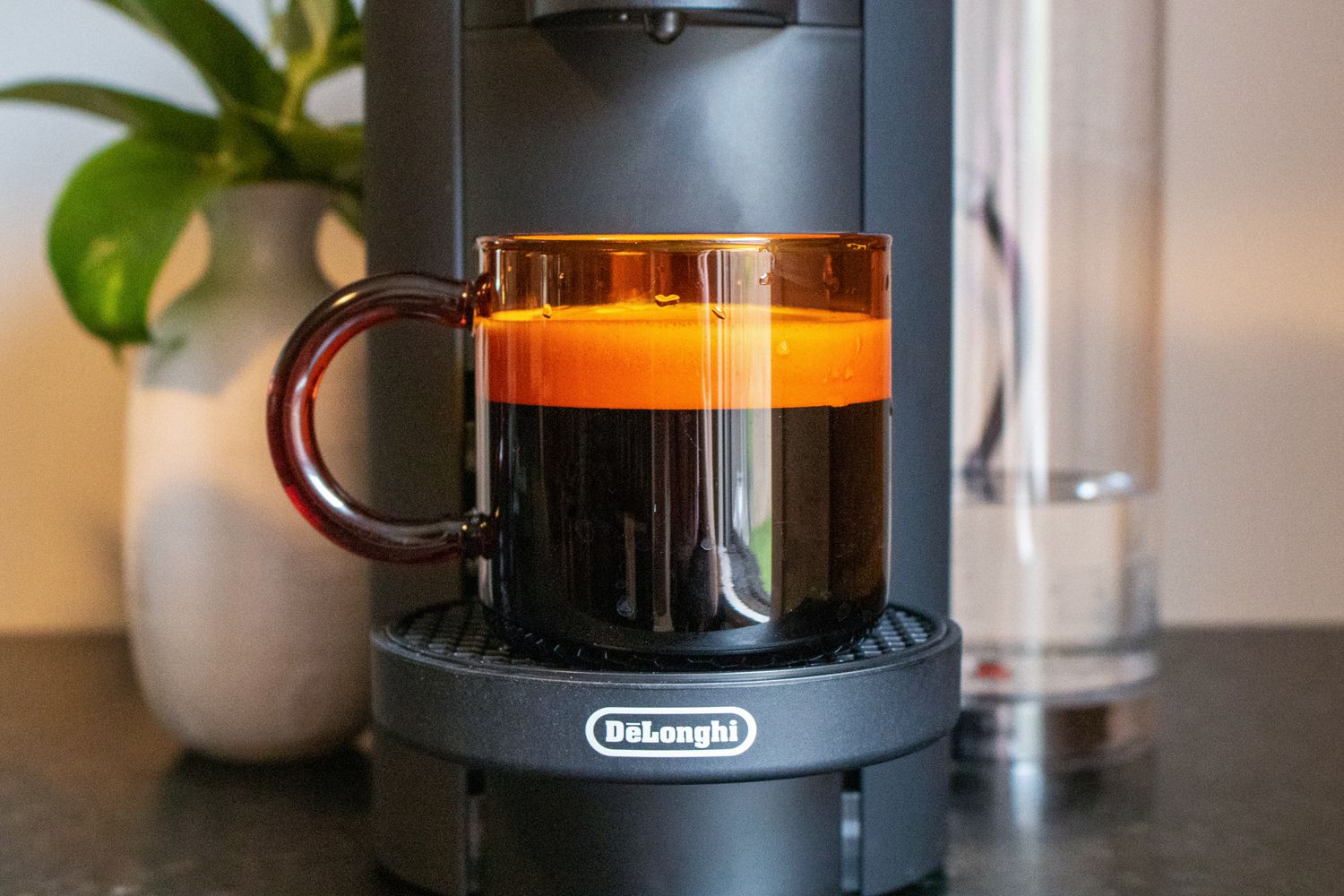 A closeup look at coffee brewed with the Nespresso with a thick layer of crema on top