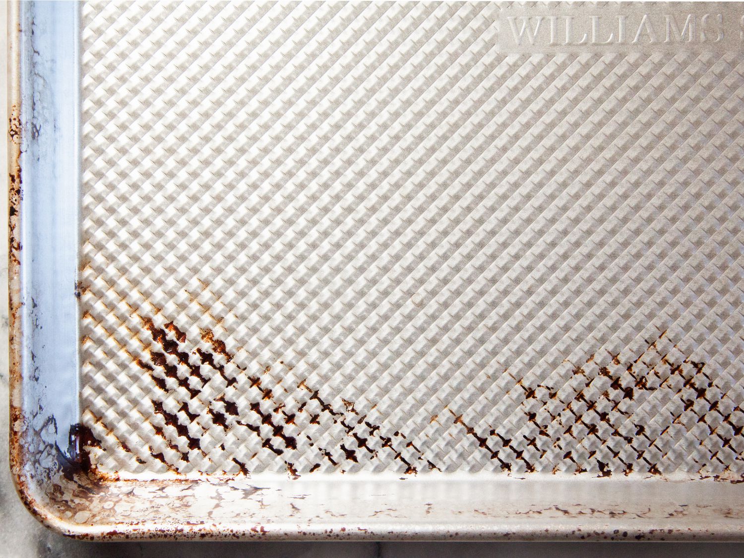 a closeup of the ridged surface of the williams sonoma pan, which got dark splotches after use.