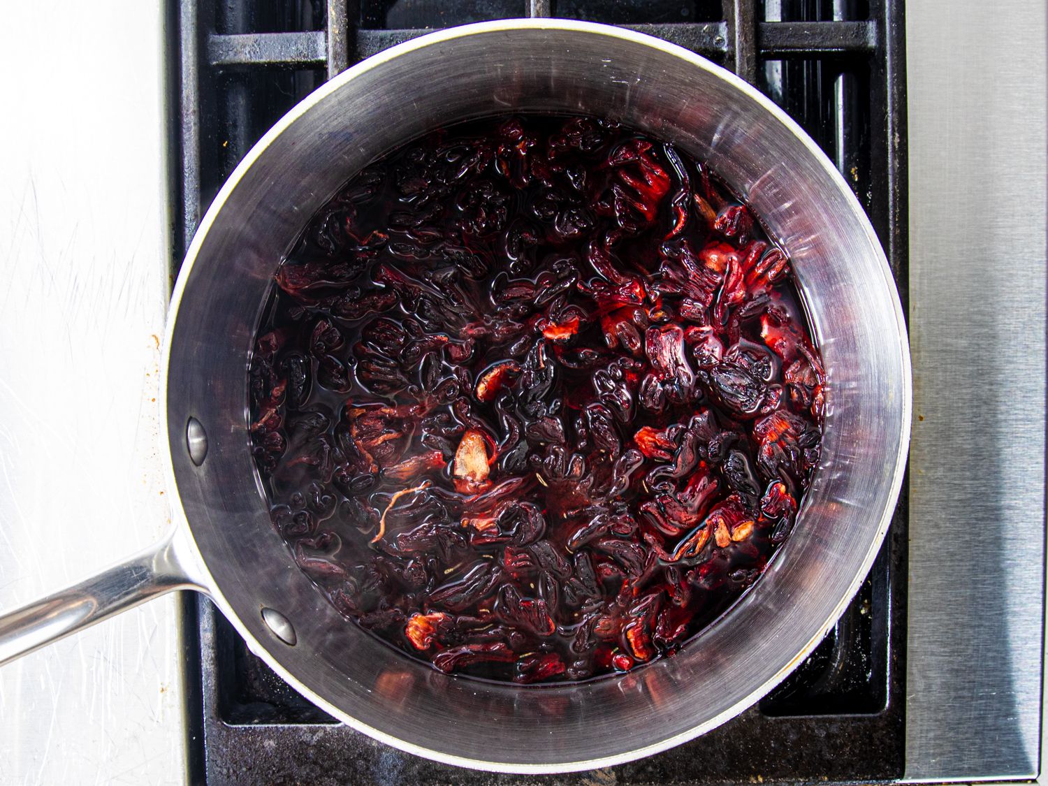 Hibiscus boiling in pot on stove