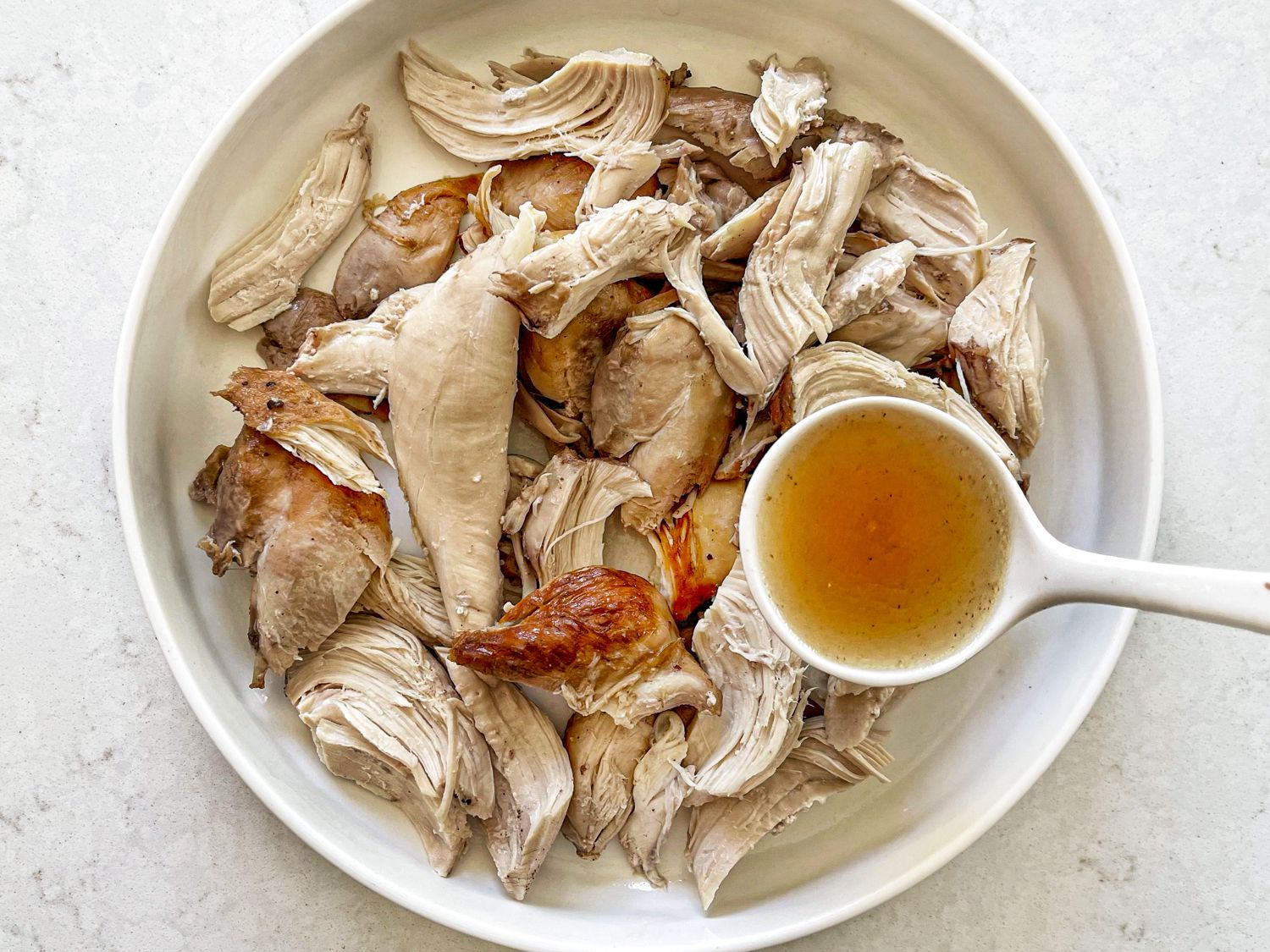 Shredded chicken mixed with homemade chicken stock.