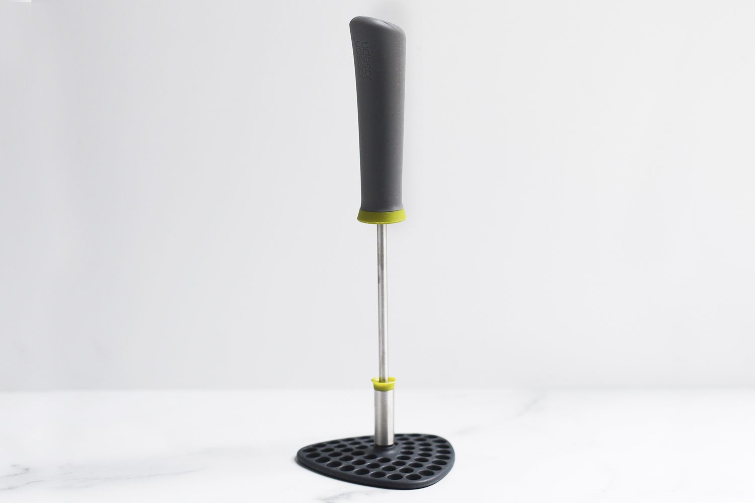 Joseph Joseph potato masher against a white background