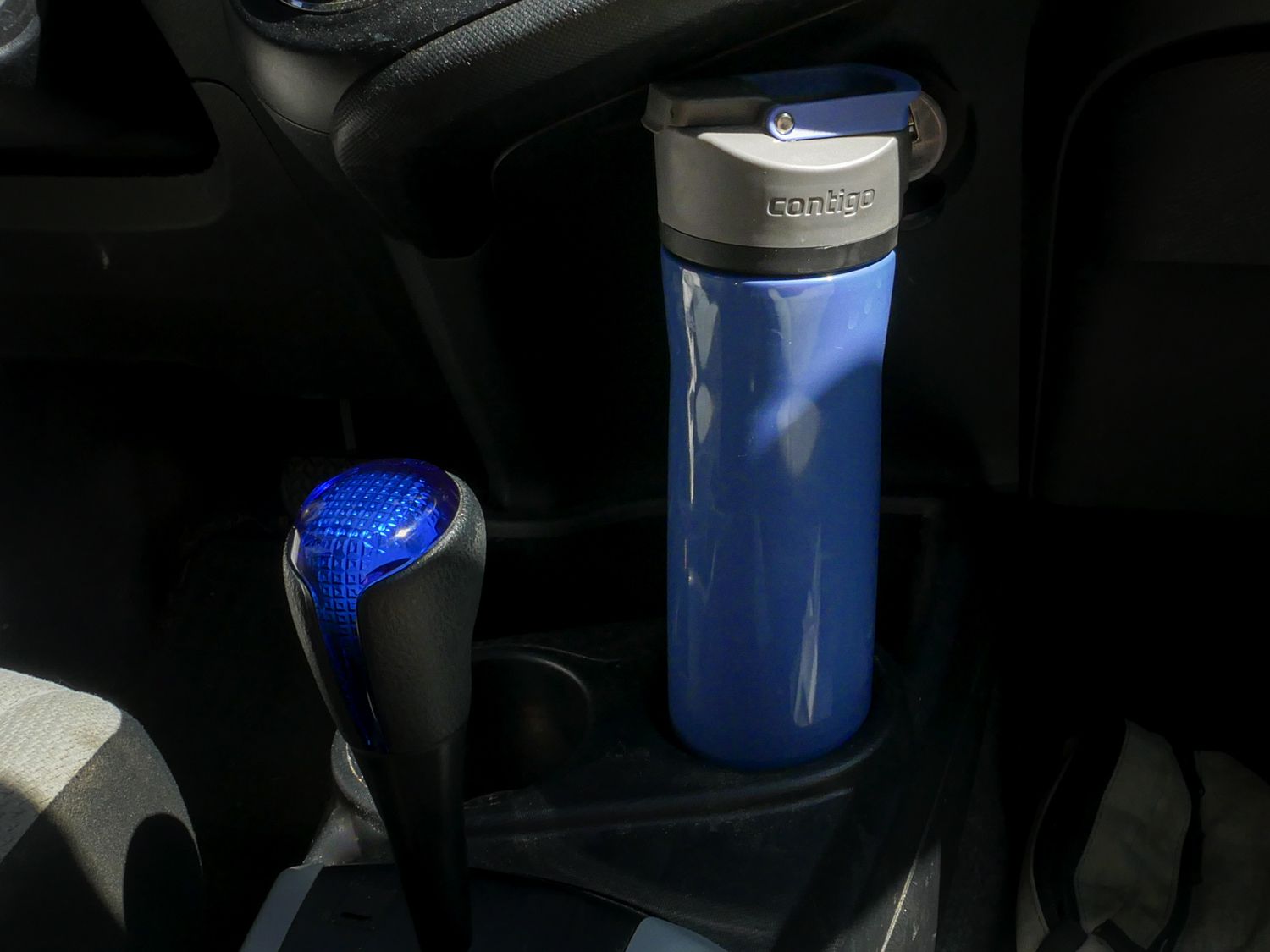 the Contigo water bottle in a car cup holder