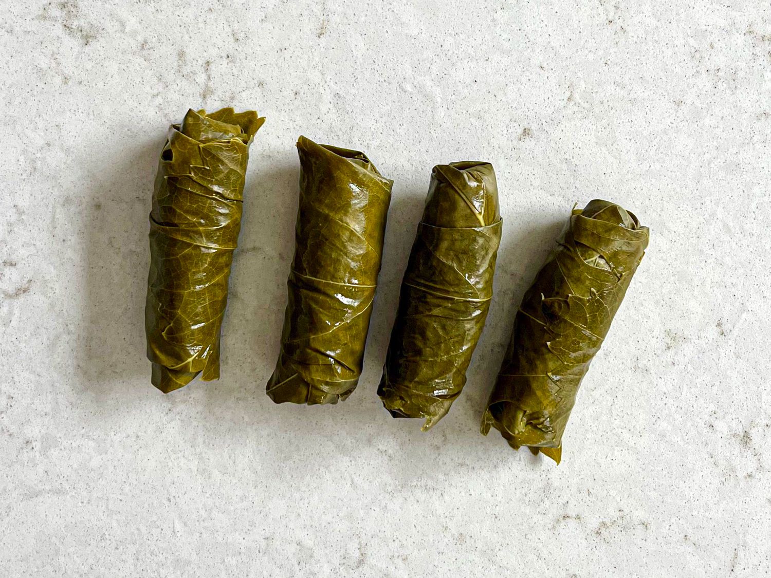Four stuffed grape leaves