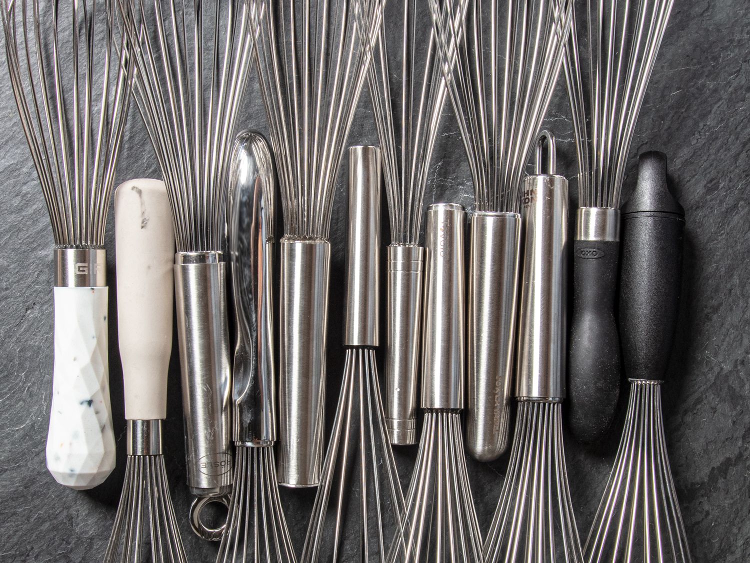 Close up image of the whisks handles in a straight line