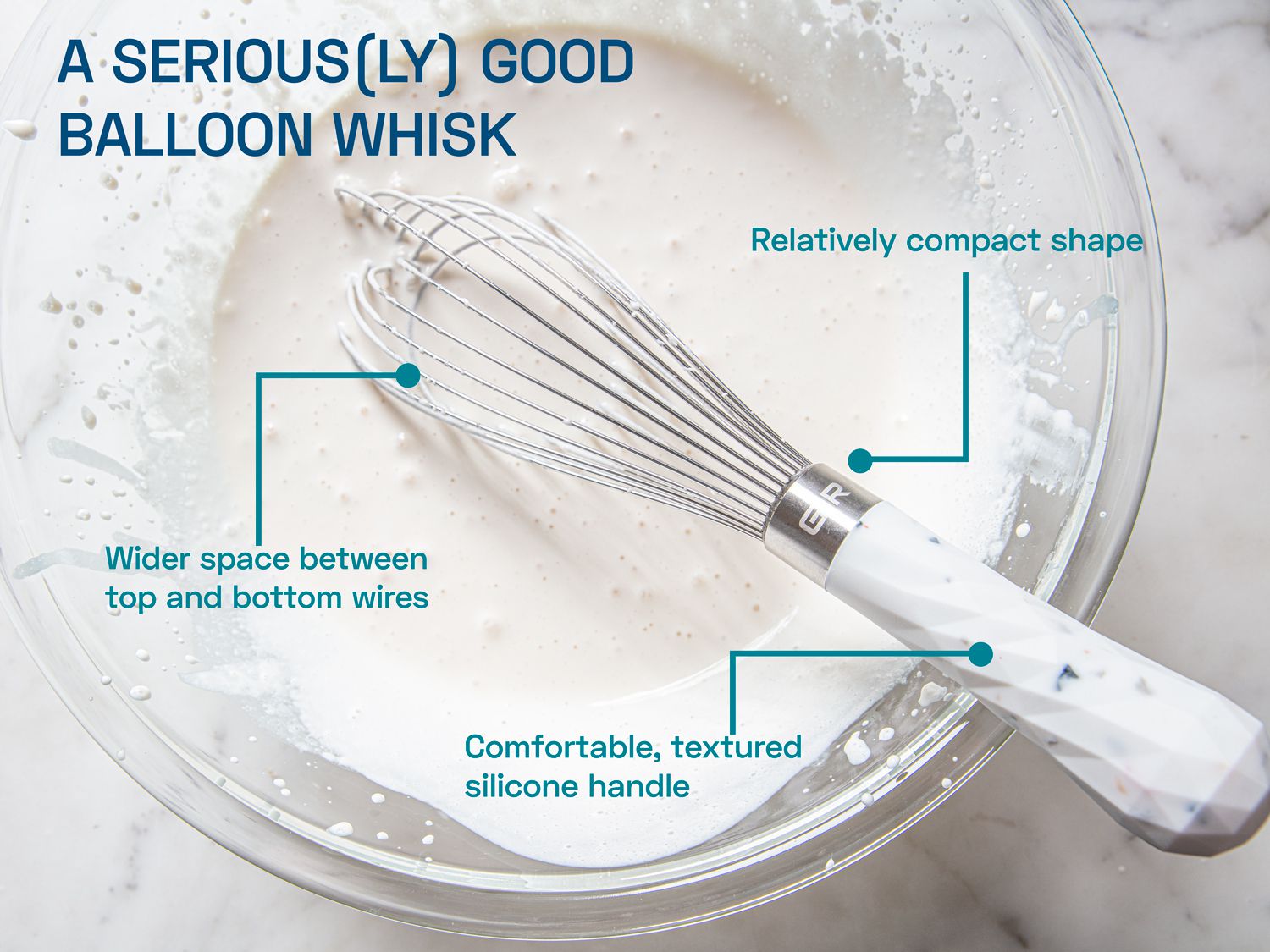 A balloon whisk in a mixing bowl with heavy whipping cream