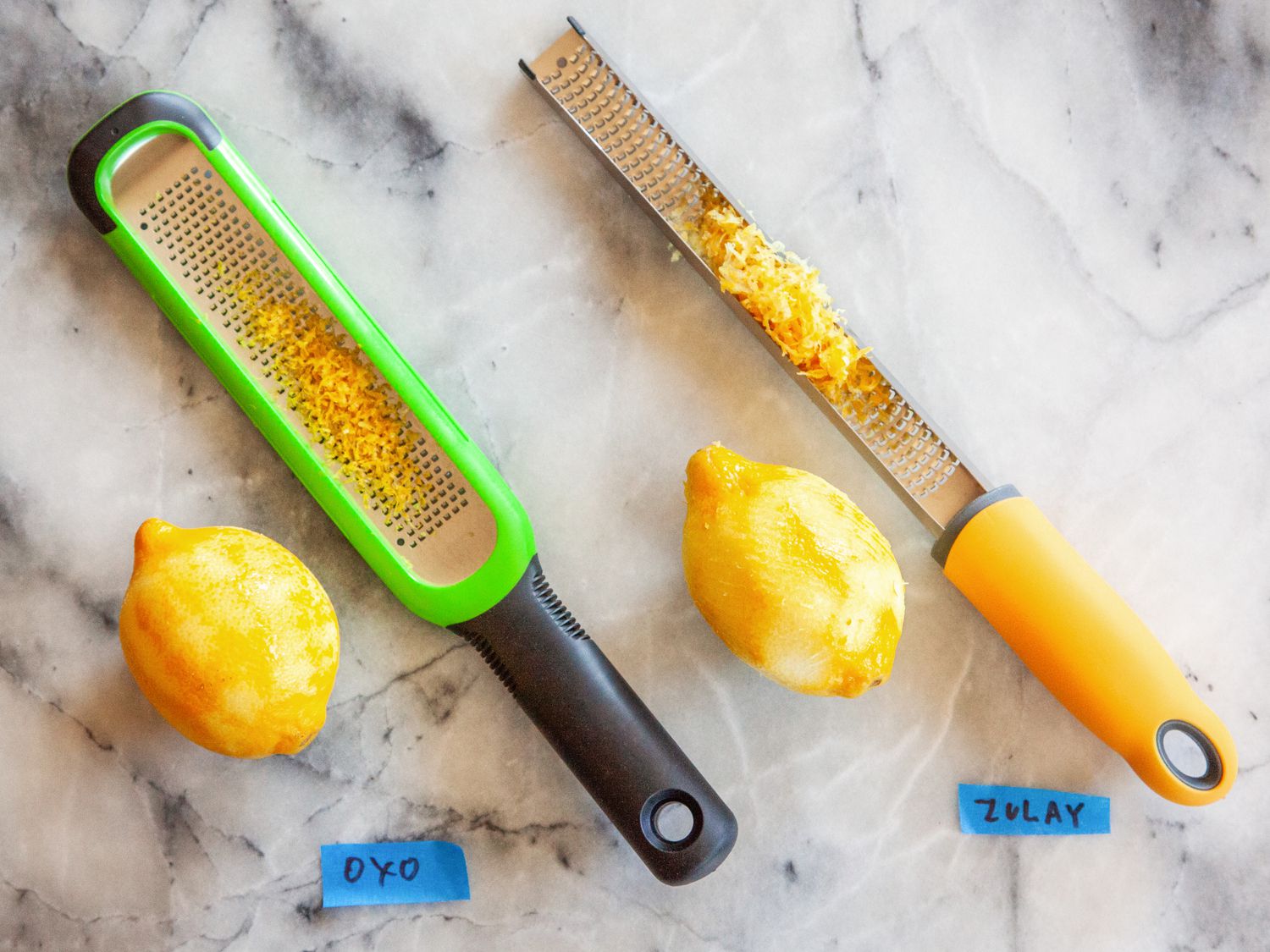 two poorly performing graters with citrus zest in them