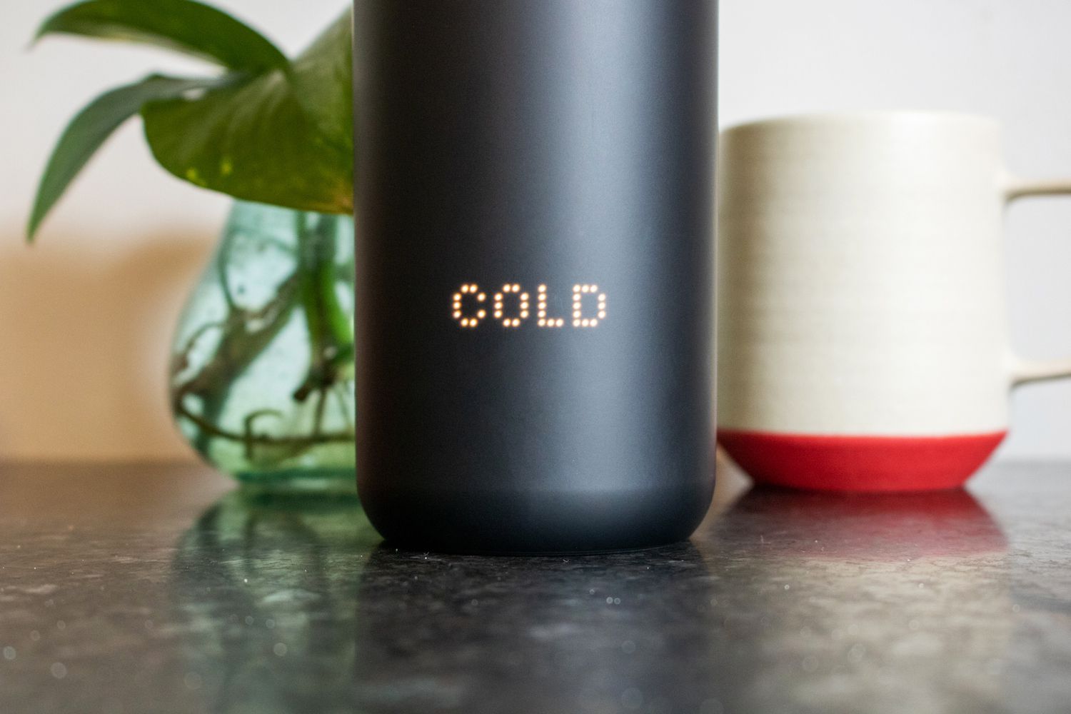 The Ember Travel Mug reading 'Cold'