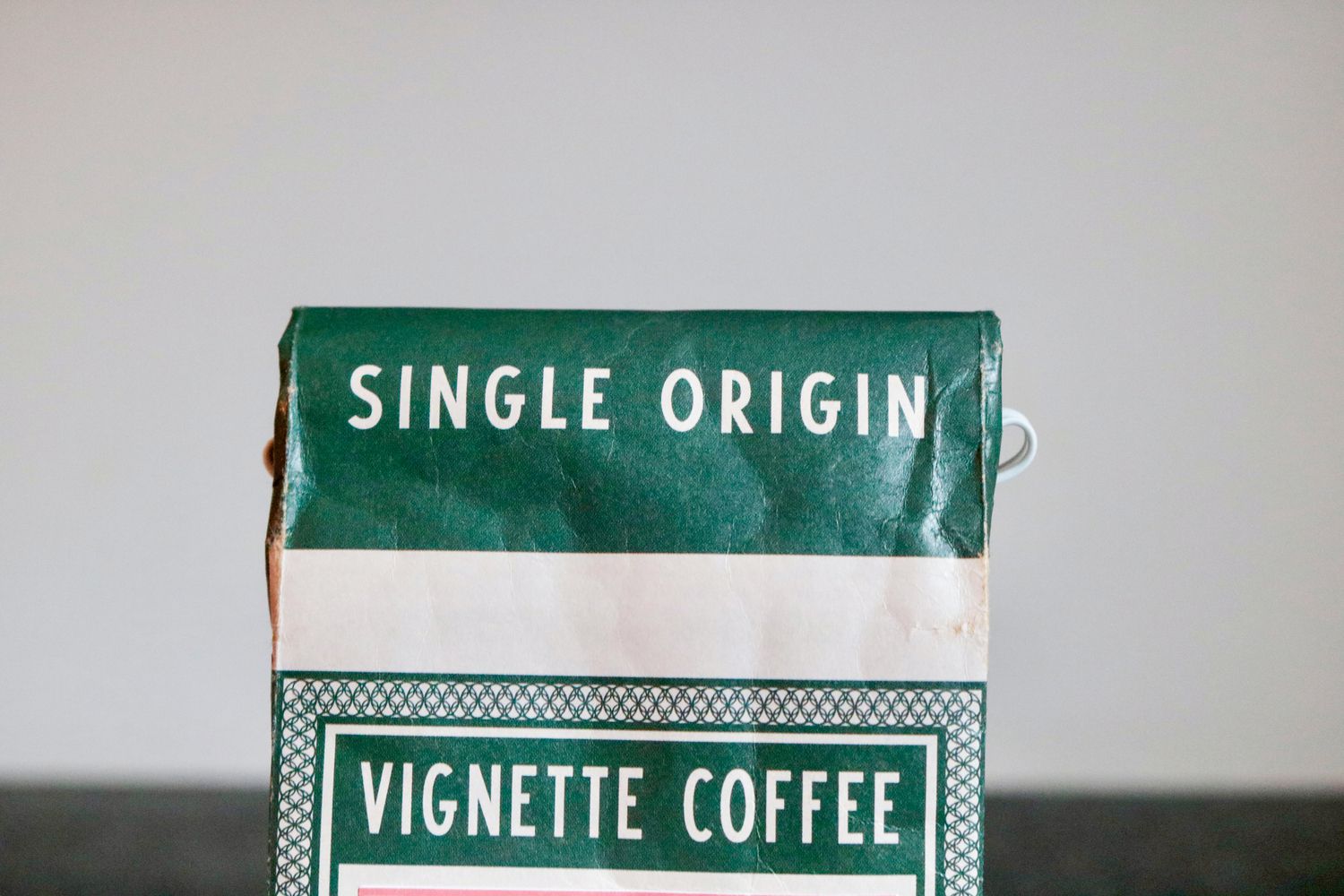 The top of a coffee bag that says