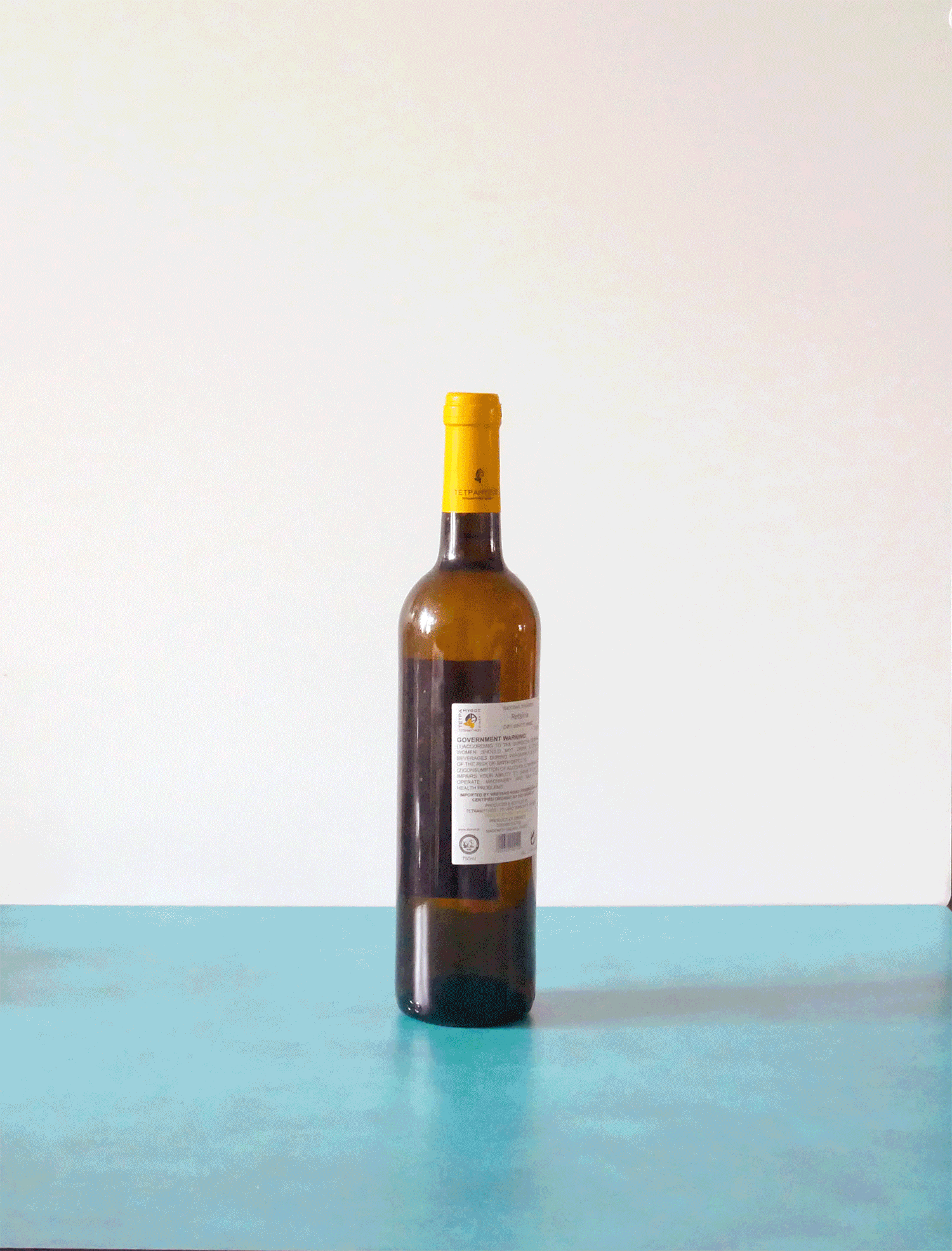 using the foil cutter and corkscrew to open a bottle of wine