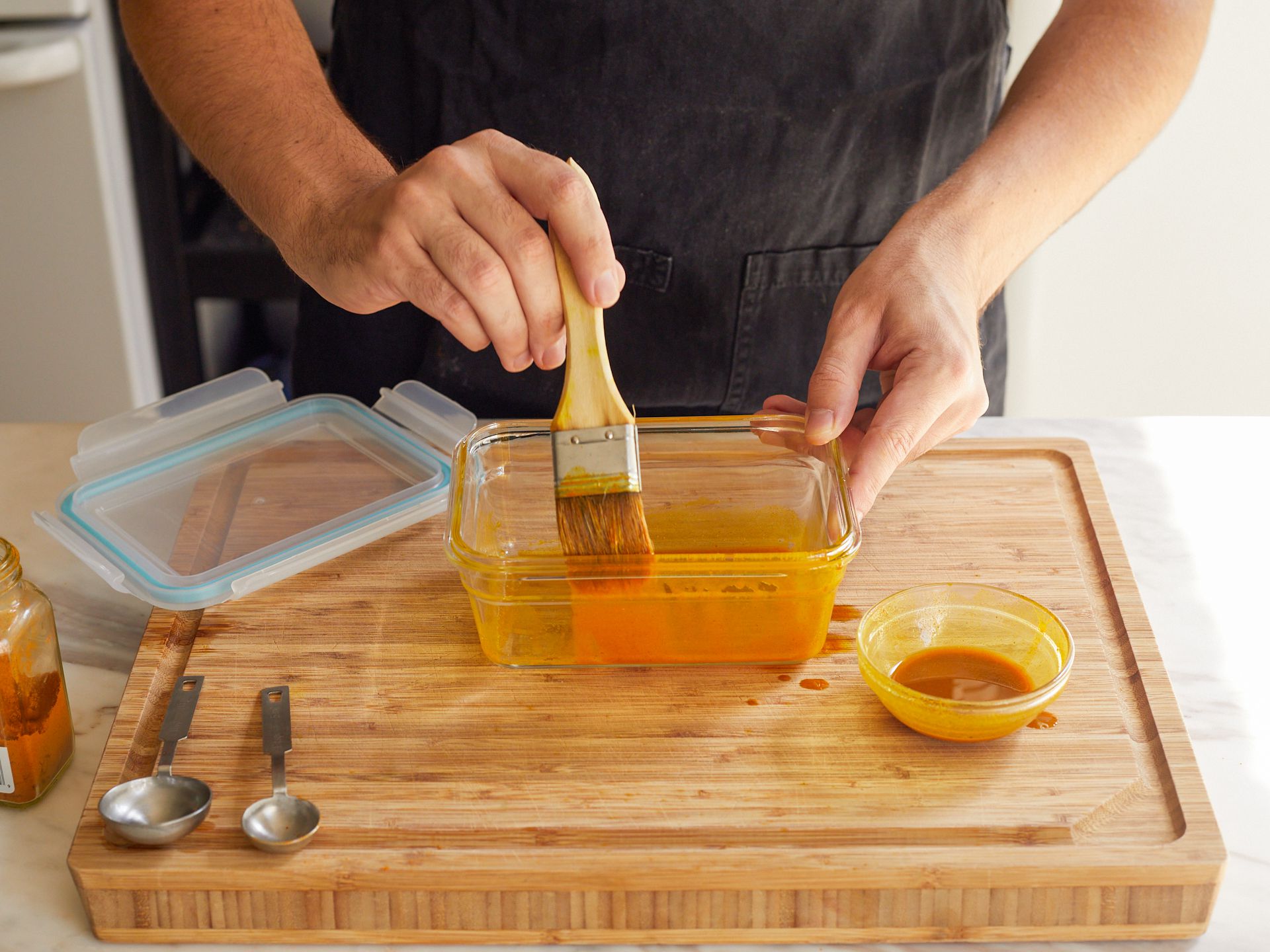 brushing the containers with a turmeric mixture to test staining.
