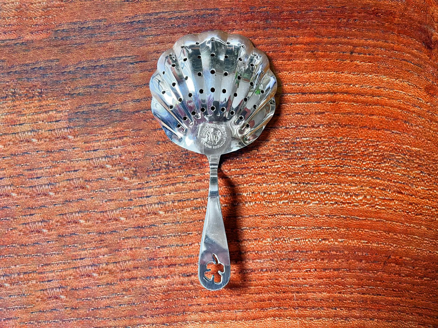 the wilkinson strainer on a wooden surface