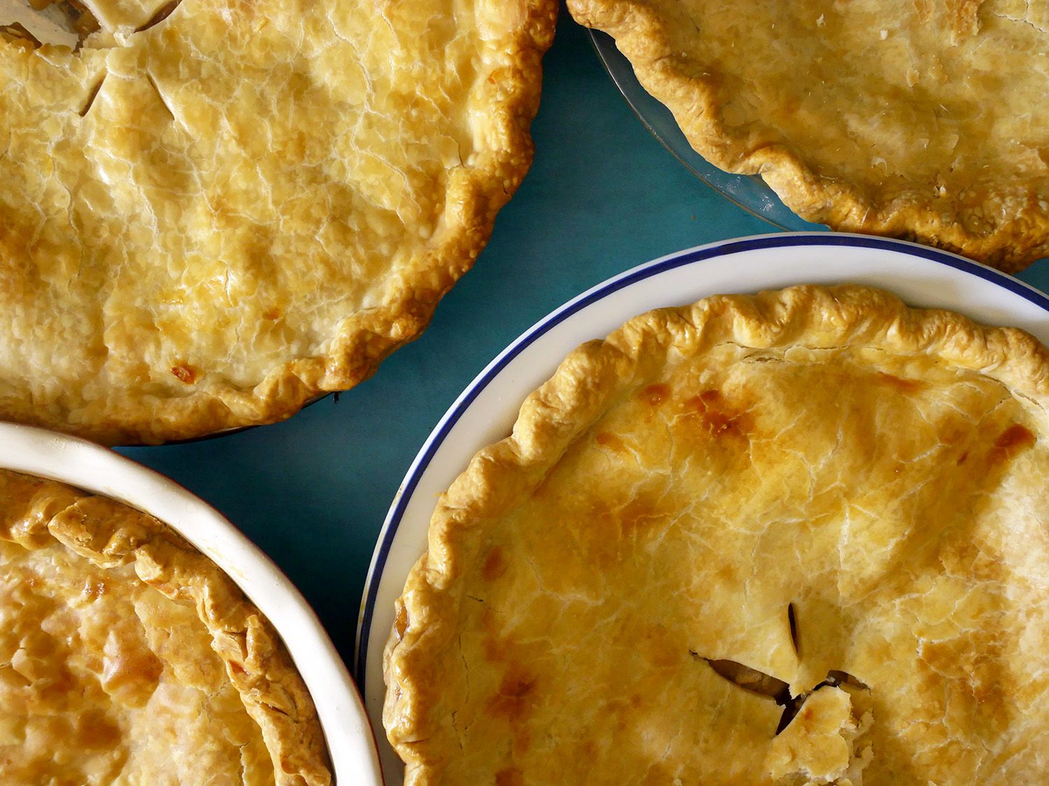 a closeup of the tops of apple pies baked in our favorite pans.