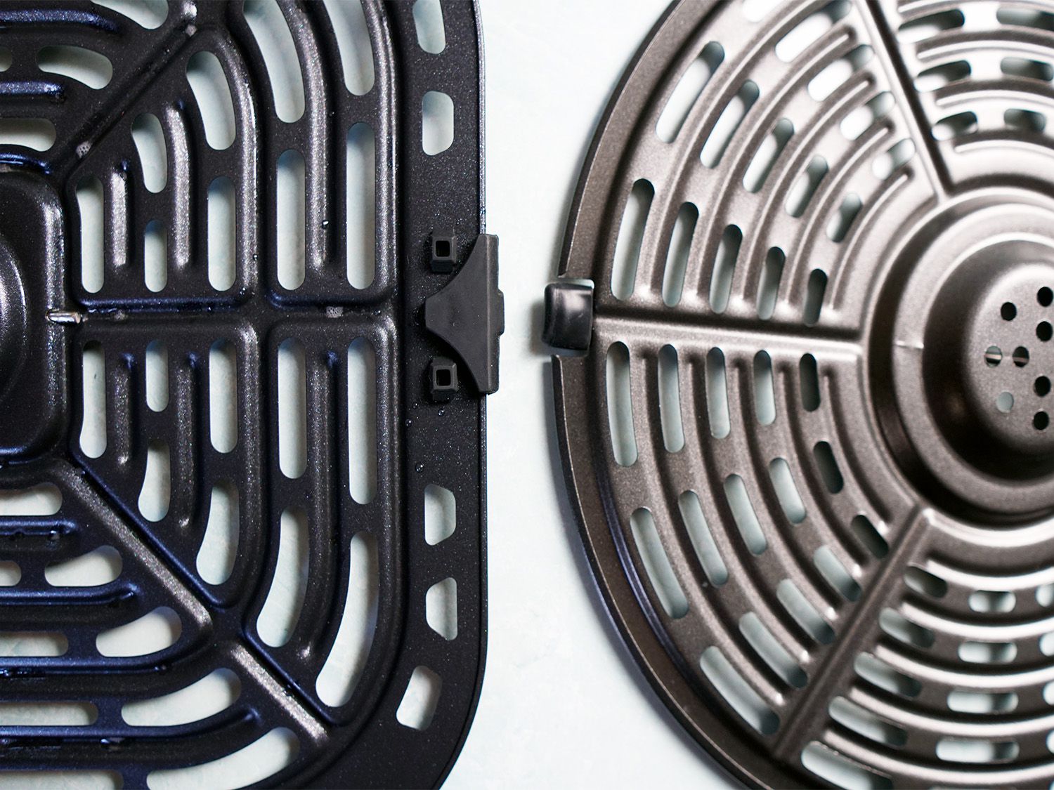two perforated basket inserts side-by-side