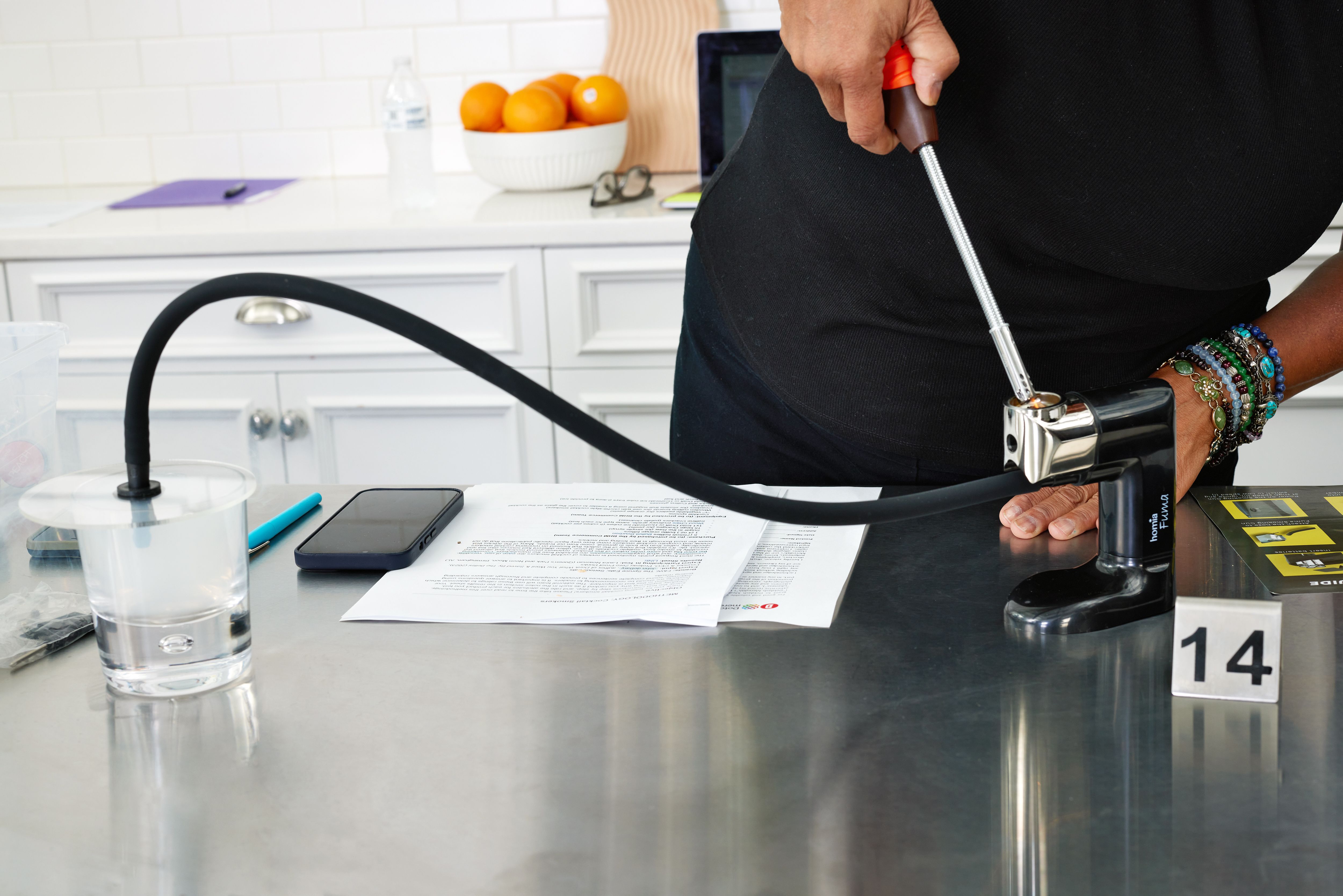 a person using a lighter to light the breville 