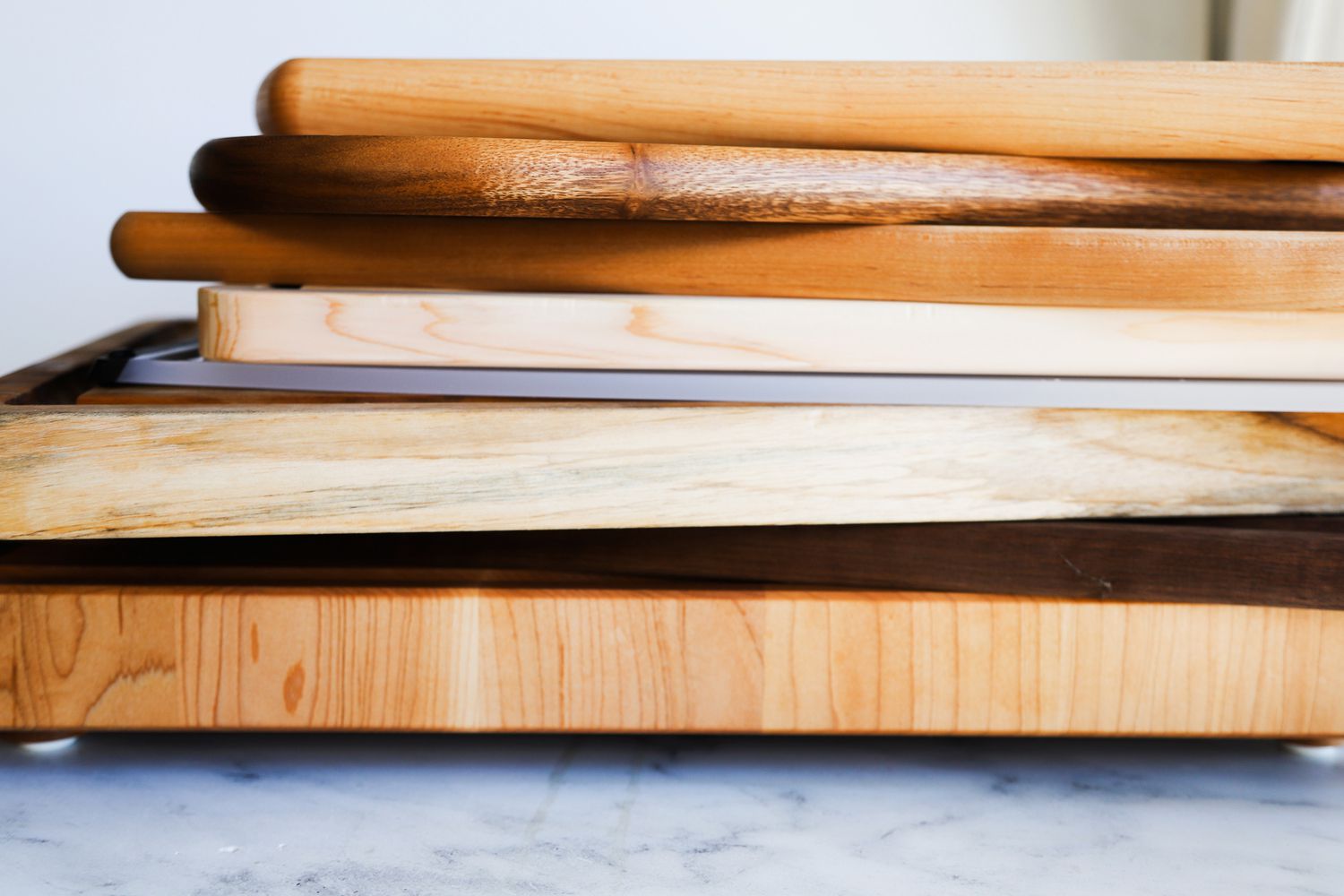 a stack of wooden carving boards