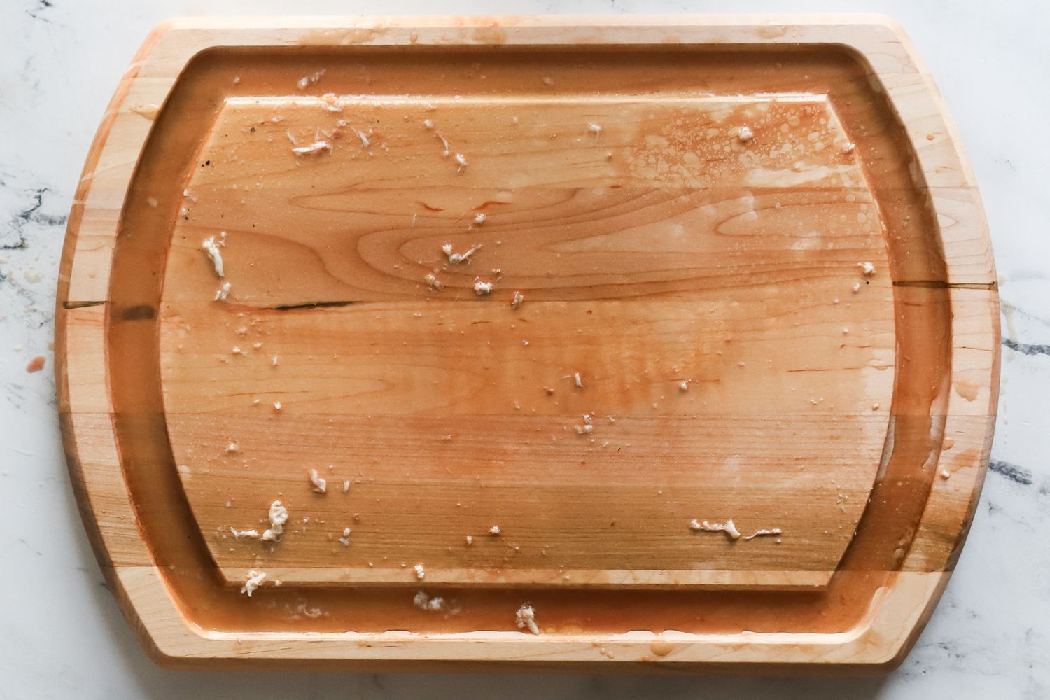 A carving board with its juice wells full