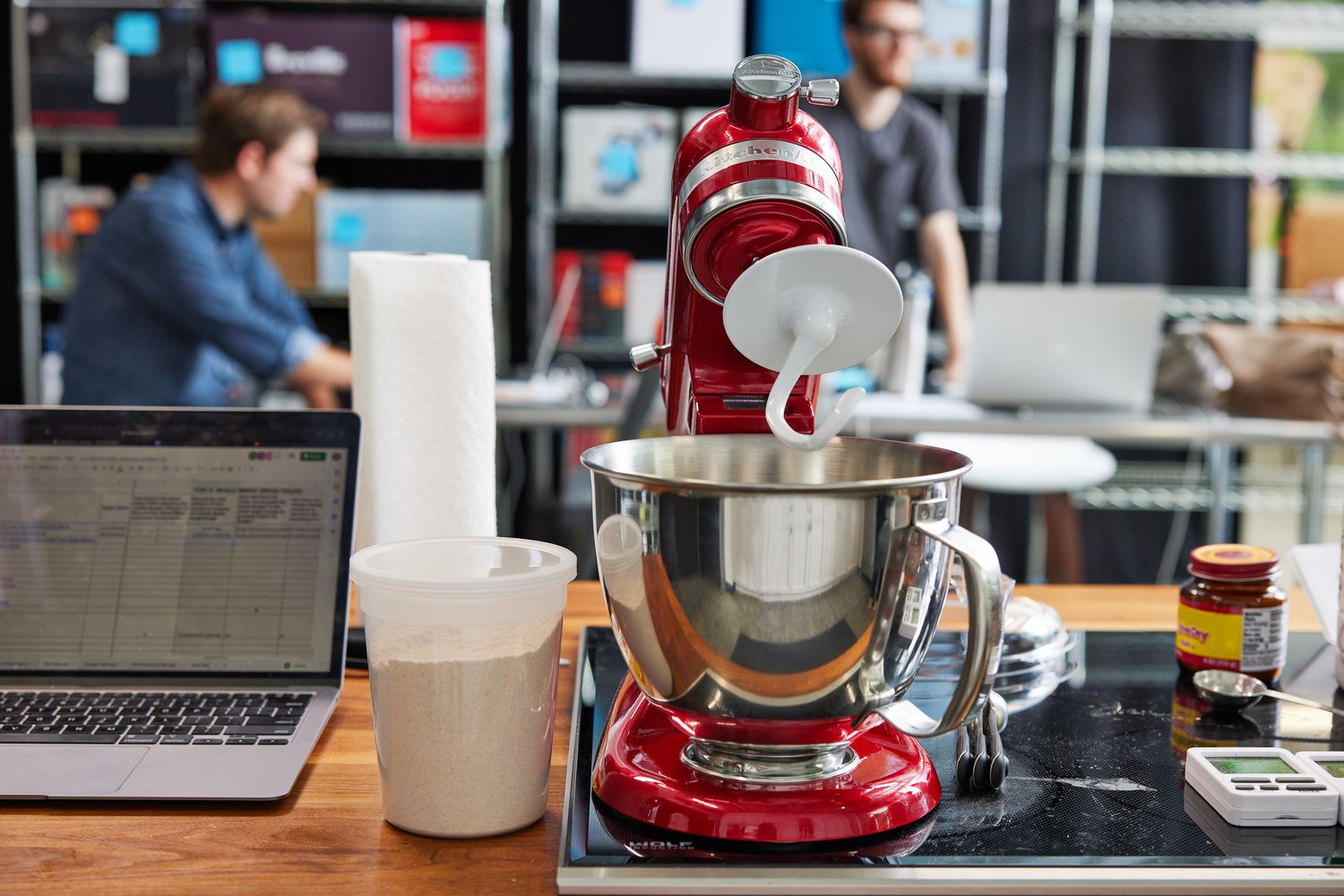 A front-on view of a tilt-head, red KitchenAid stand ixer