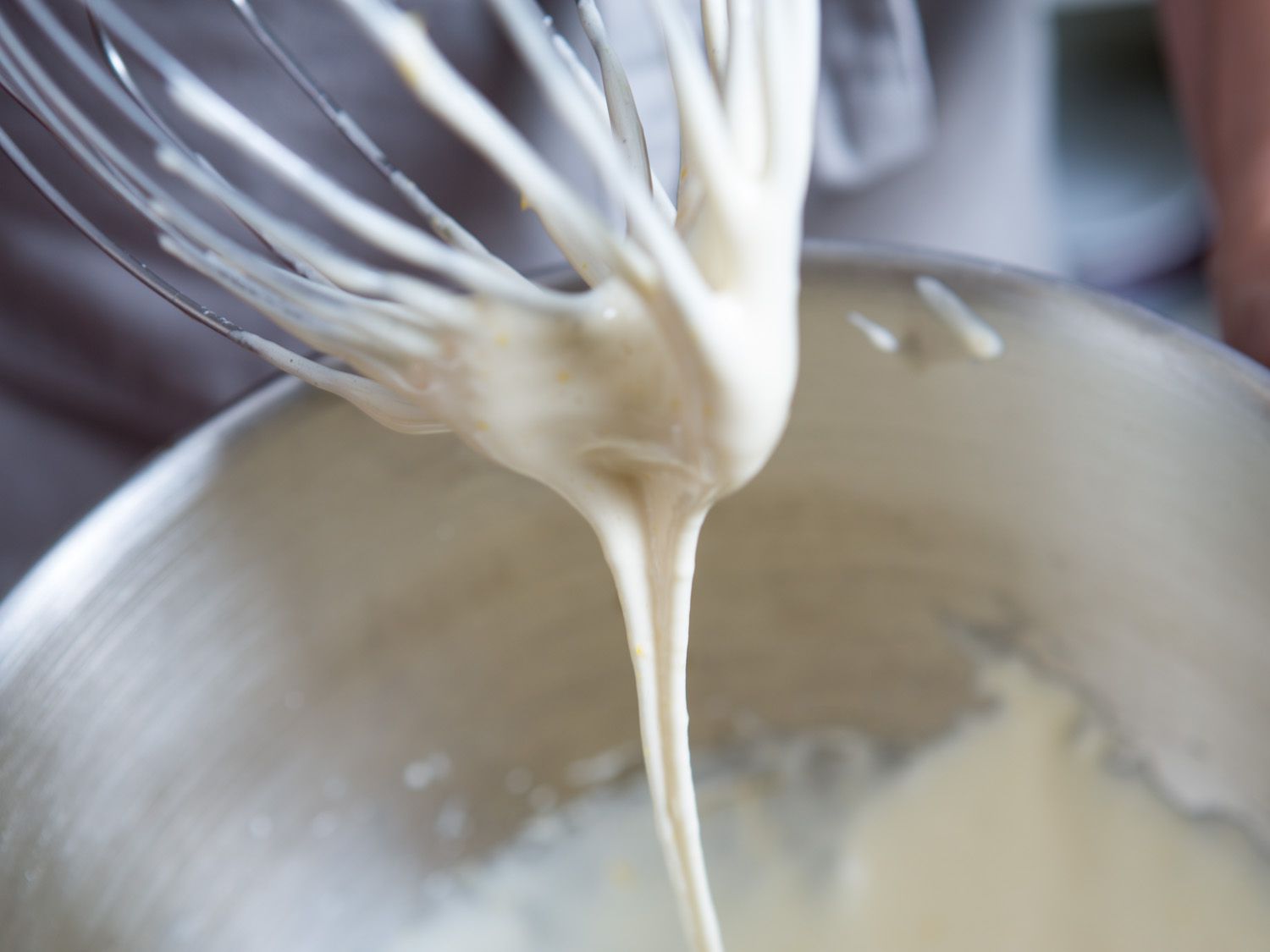 A closeup looking at the whisk attachment of a stand mixer