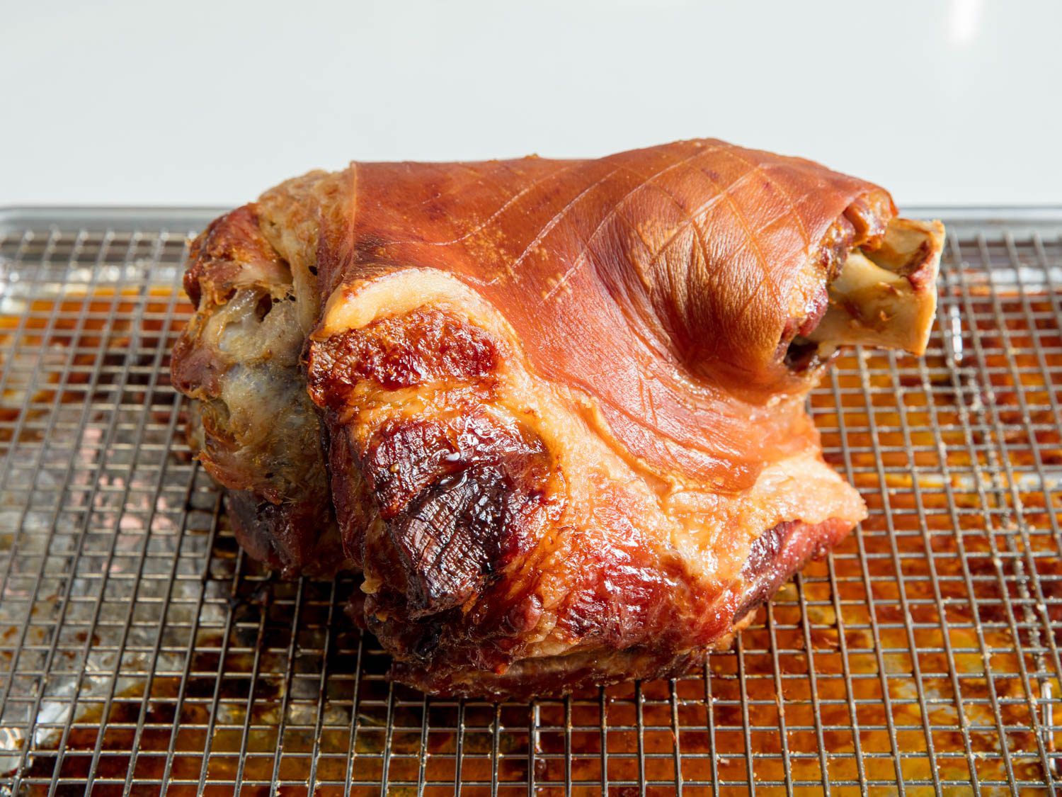Slow-roasted pork shoulder ready to be finished under high heat.
