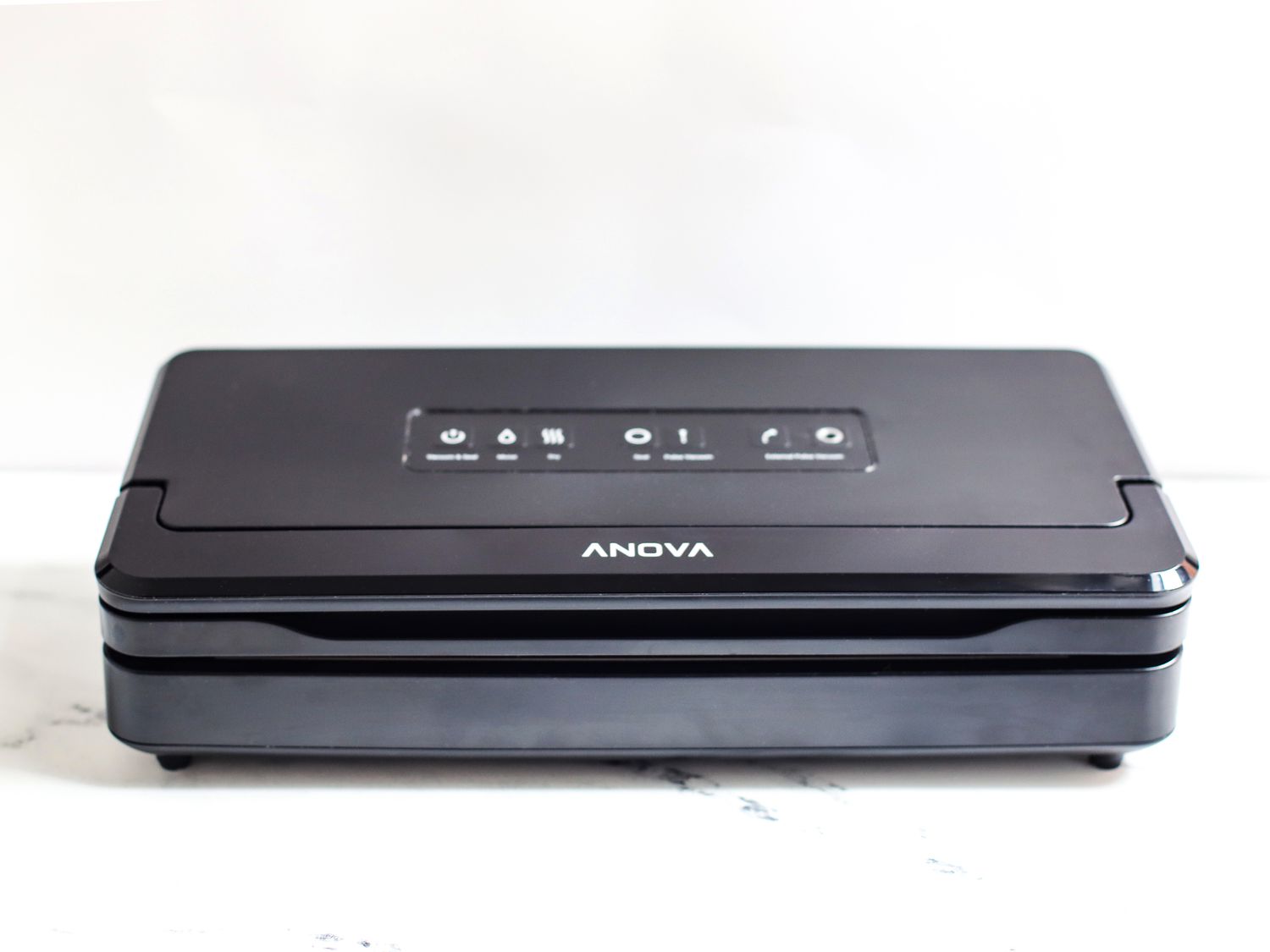 Anova Pro vacuum sealer on a marble countertop