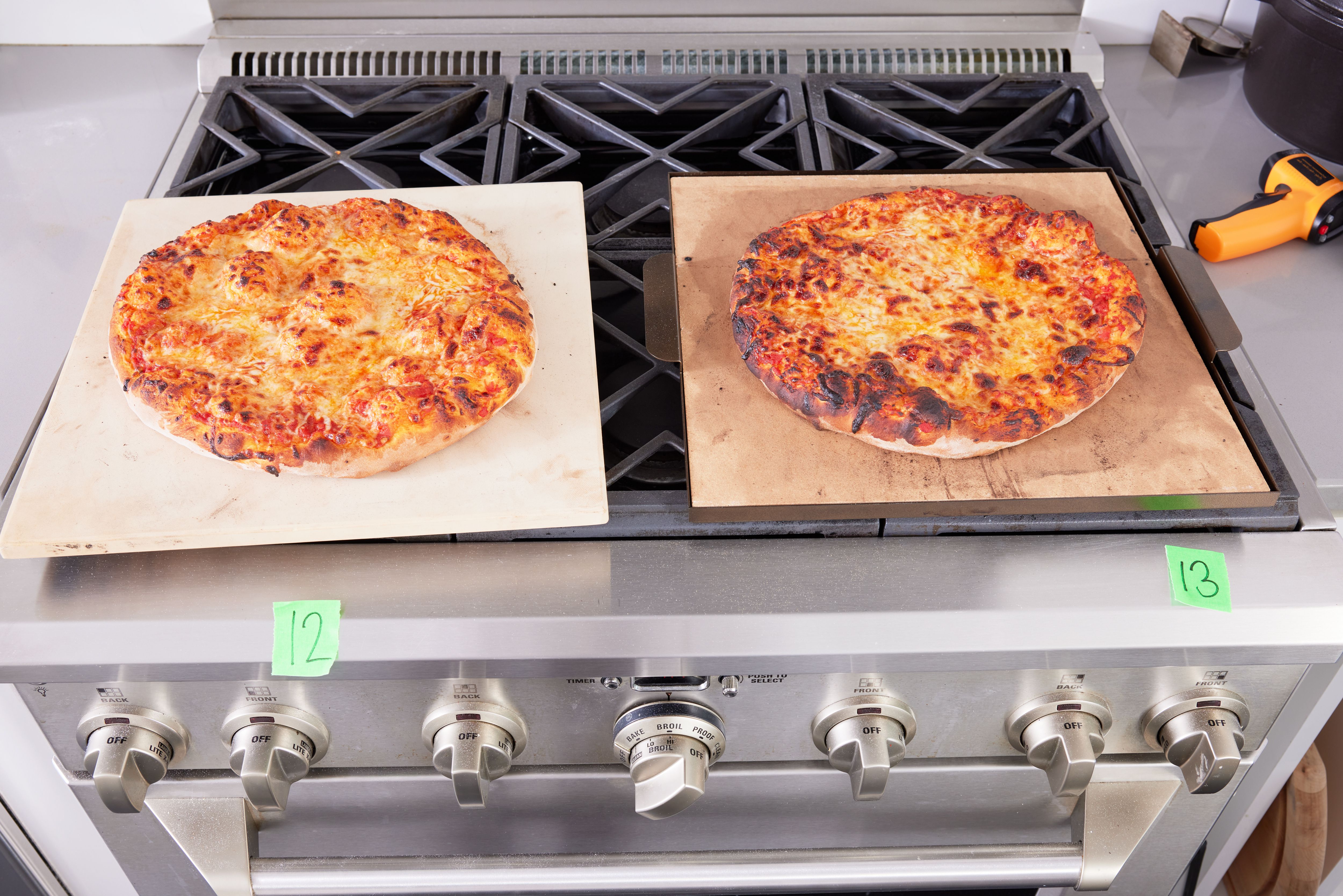 Two baked pizzas on two baking stones 