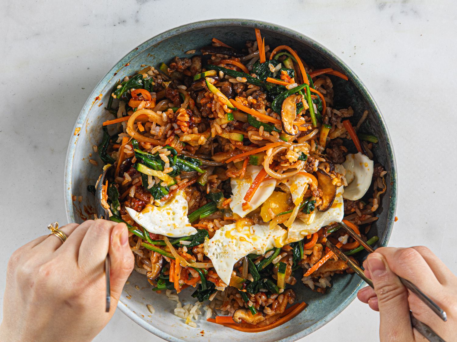Overhead view of mixing bibimbap