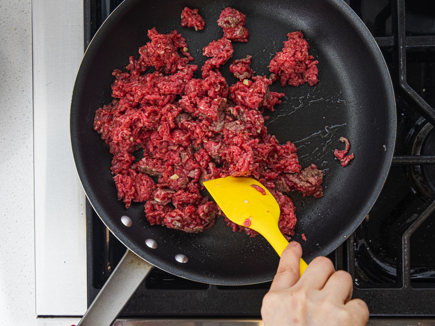 Overhead view of booking marinated beef in a pan