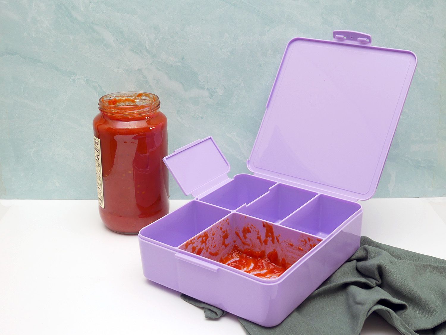bento box with sauce inside it