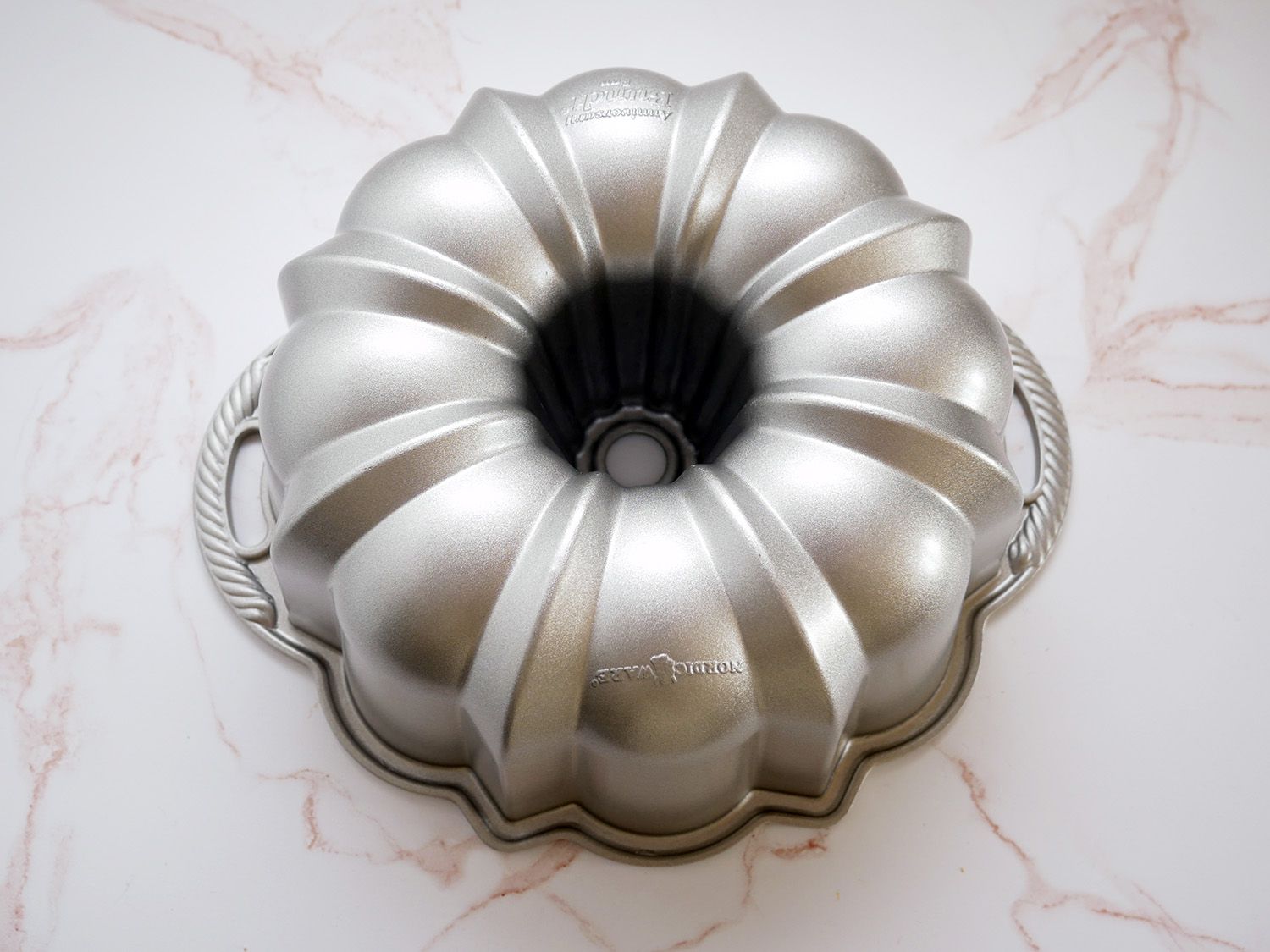 Nordic Ware Anniversary bundt pan on marble countertop