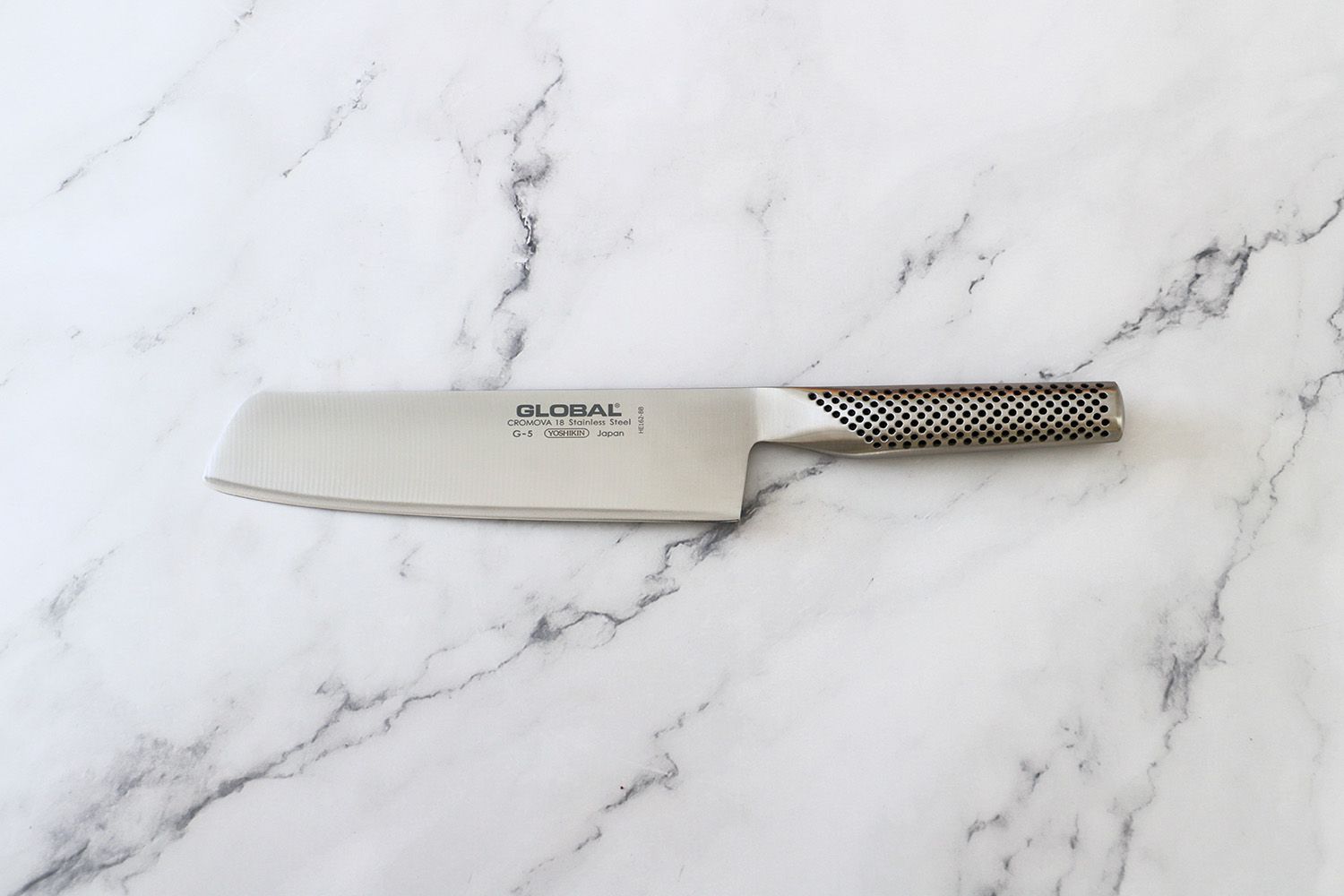 the Global nakiri knife on a marble surface