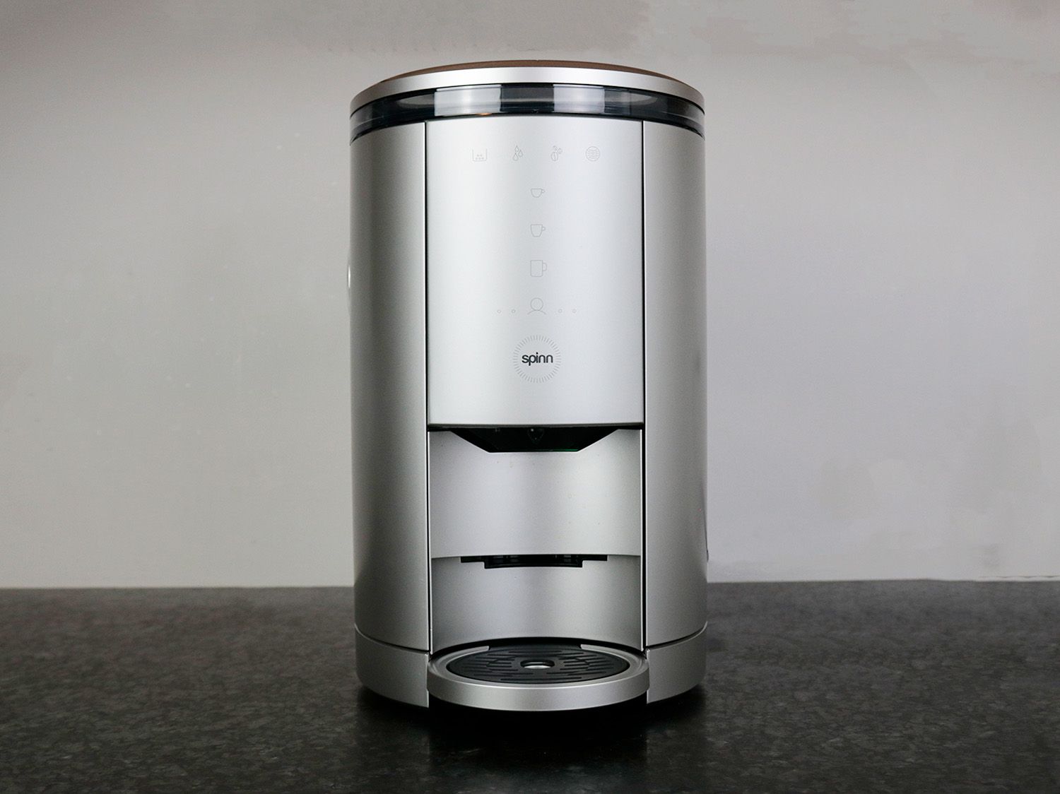 the spinn coffee maker on a black surface