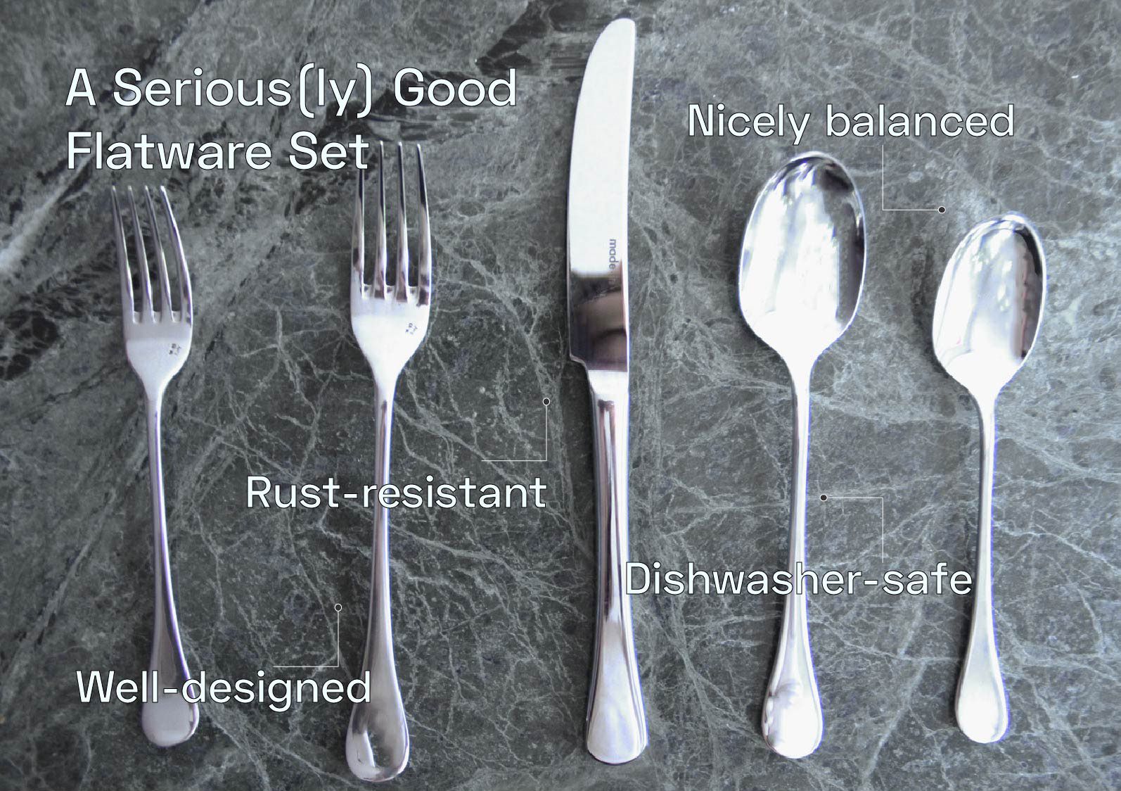 A silverware set on a grey surface with text points around it