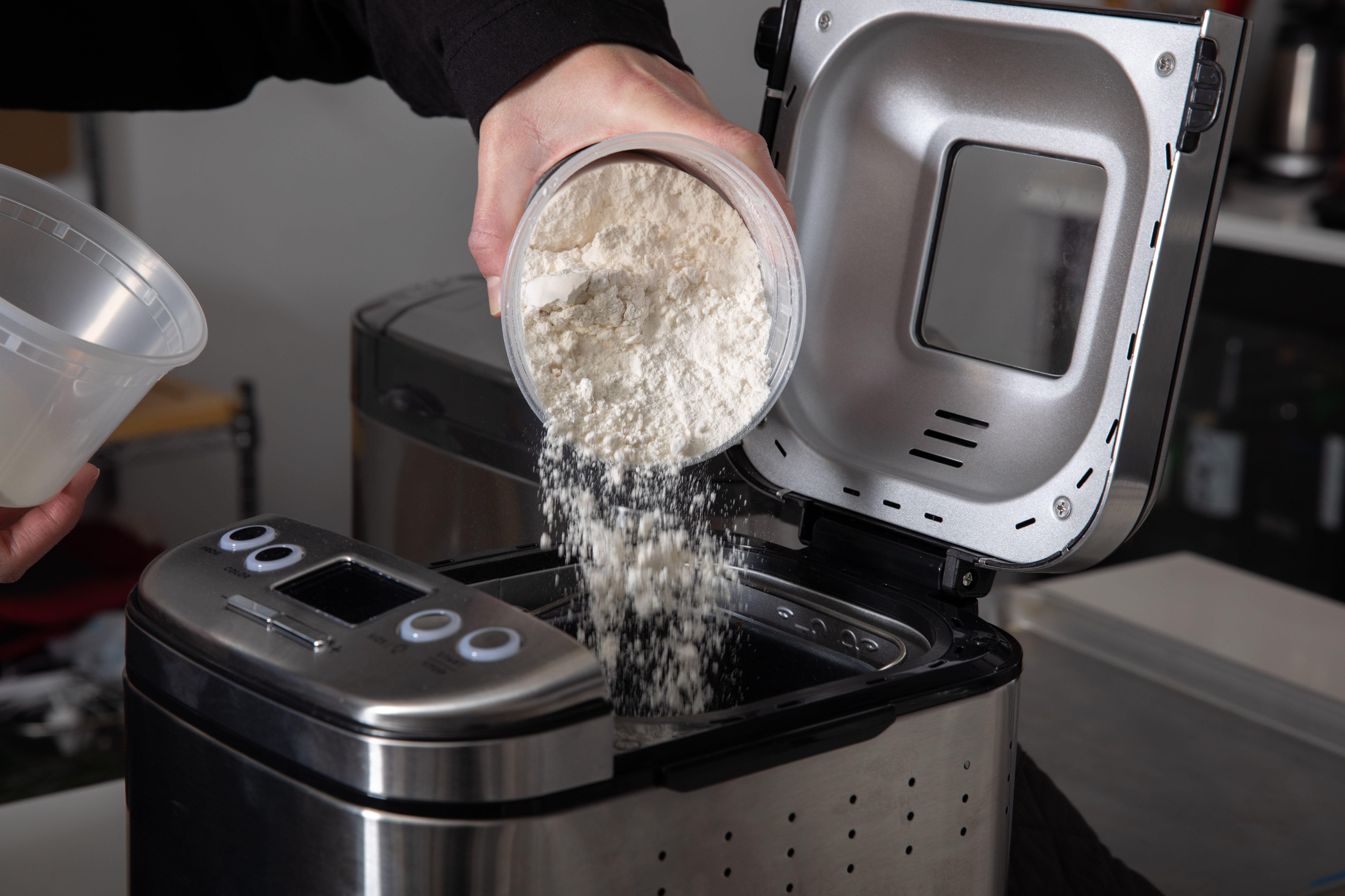 dry ingredients being added to a bread machine