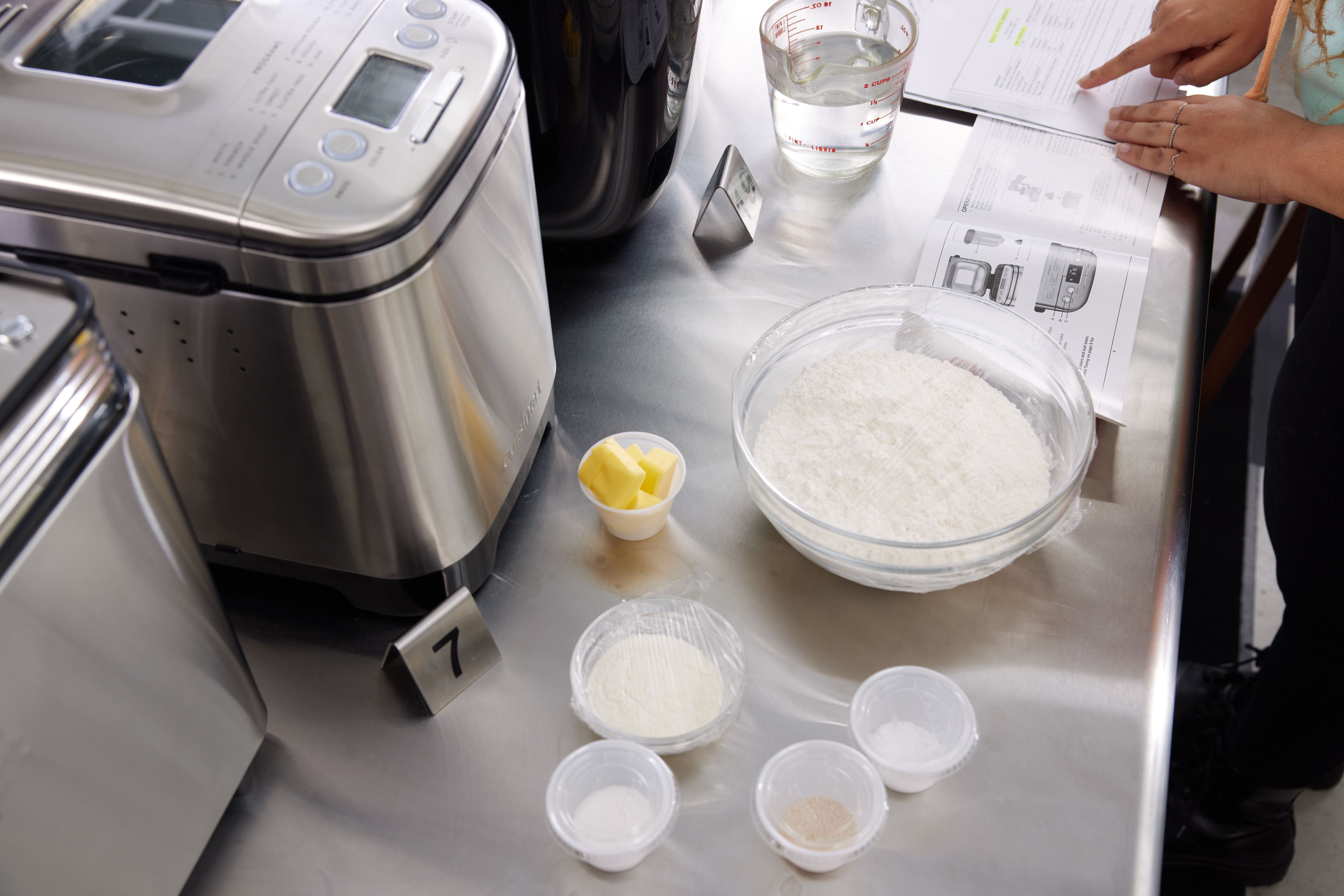 dry ingredients lined up in front of a bread machine