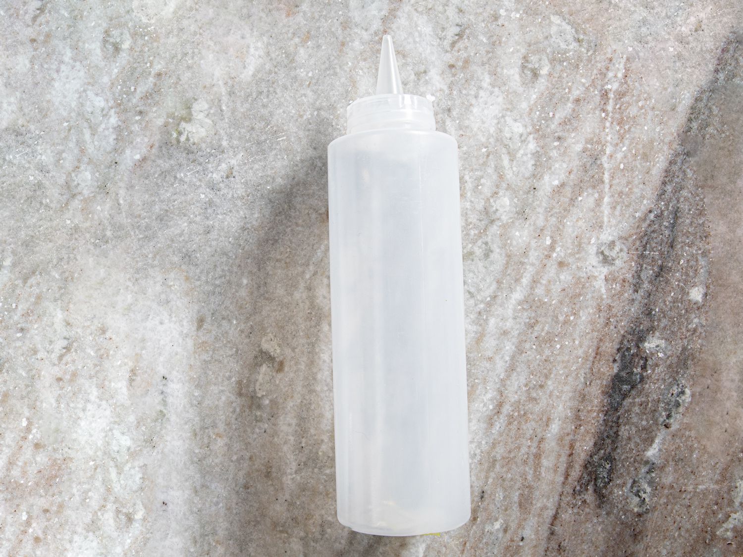 kegworks squeeze bottle on grey marble countertop