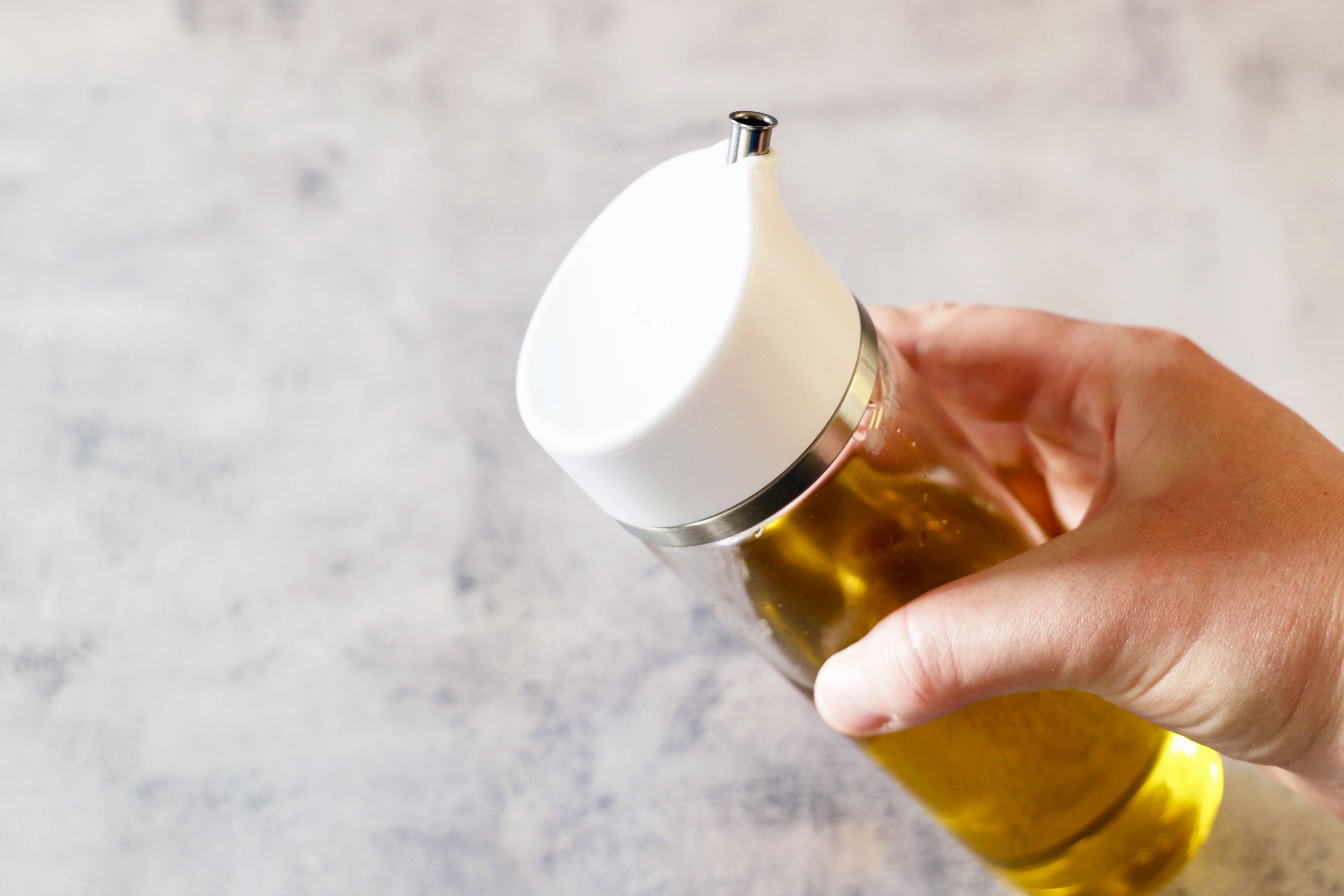 a closeup of the lid and wide mouth opening of the oxo dispenser