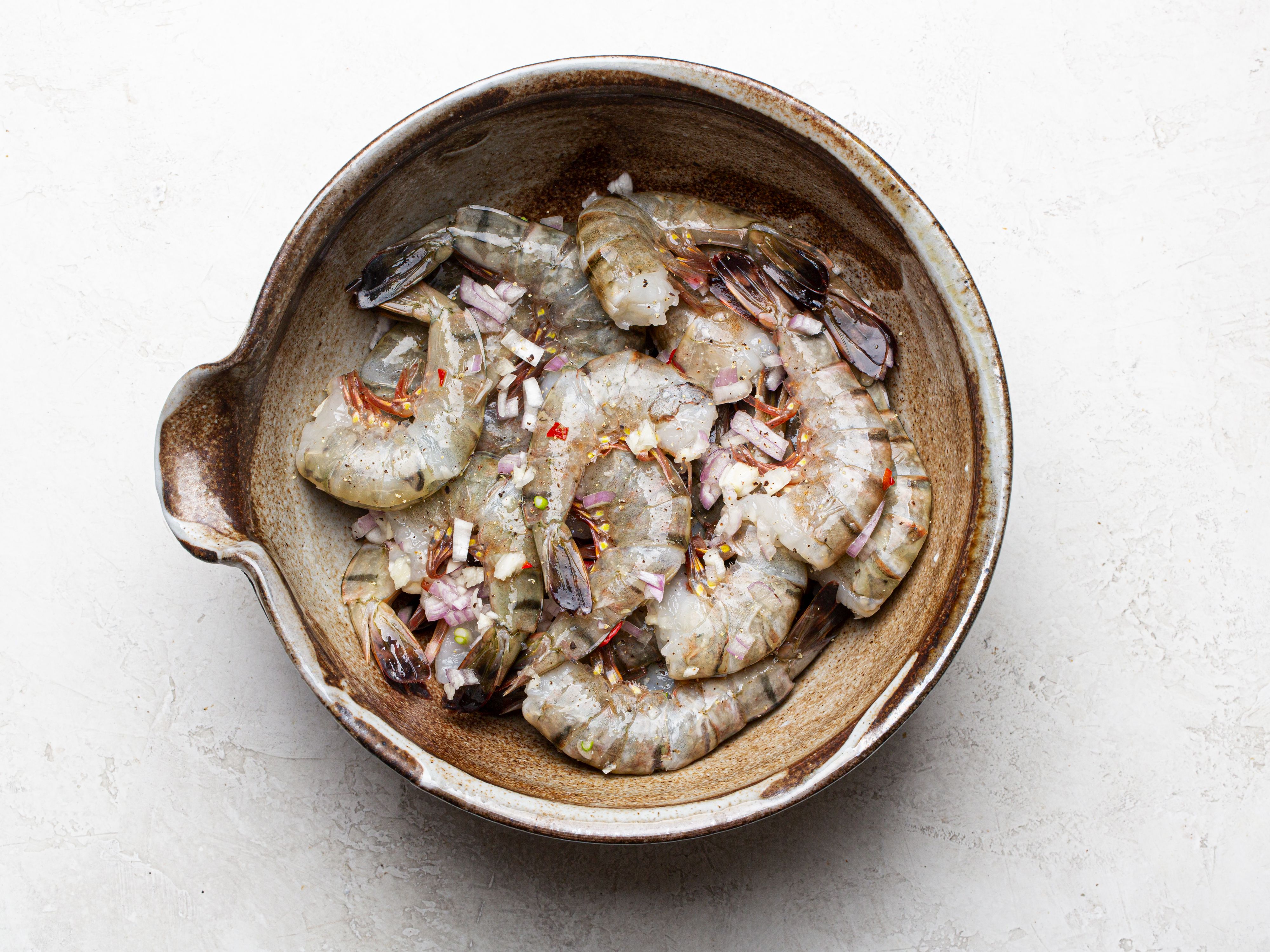 Overhead view of shrimp marinating
